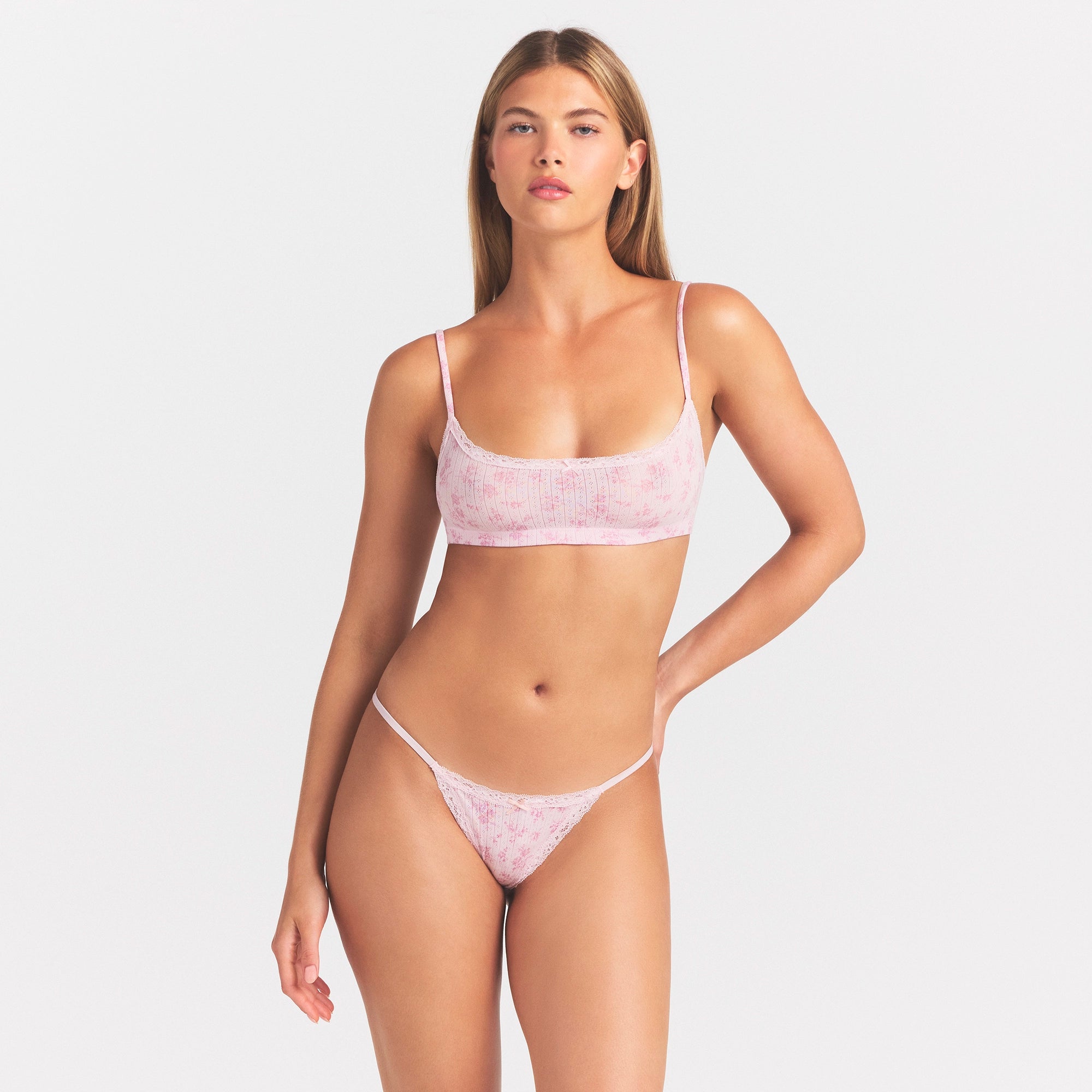 LIGHTWEIGHT COTTON POINTELLE LACE STRING THONG | BLOOM DAINTY FLORAL ON A MODEL SIDE VIEW @ | FOCUS: 0.0, 1.0, 0.9