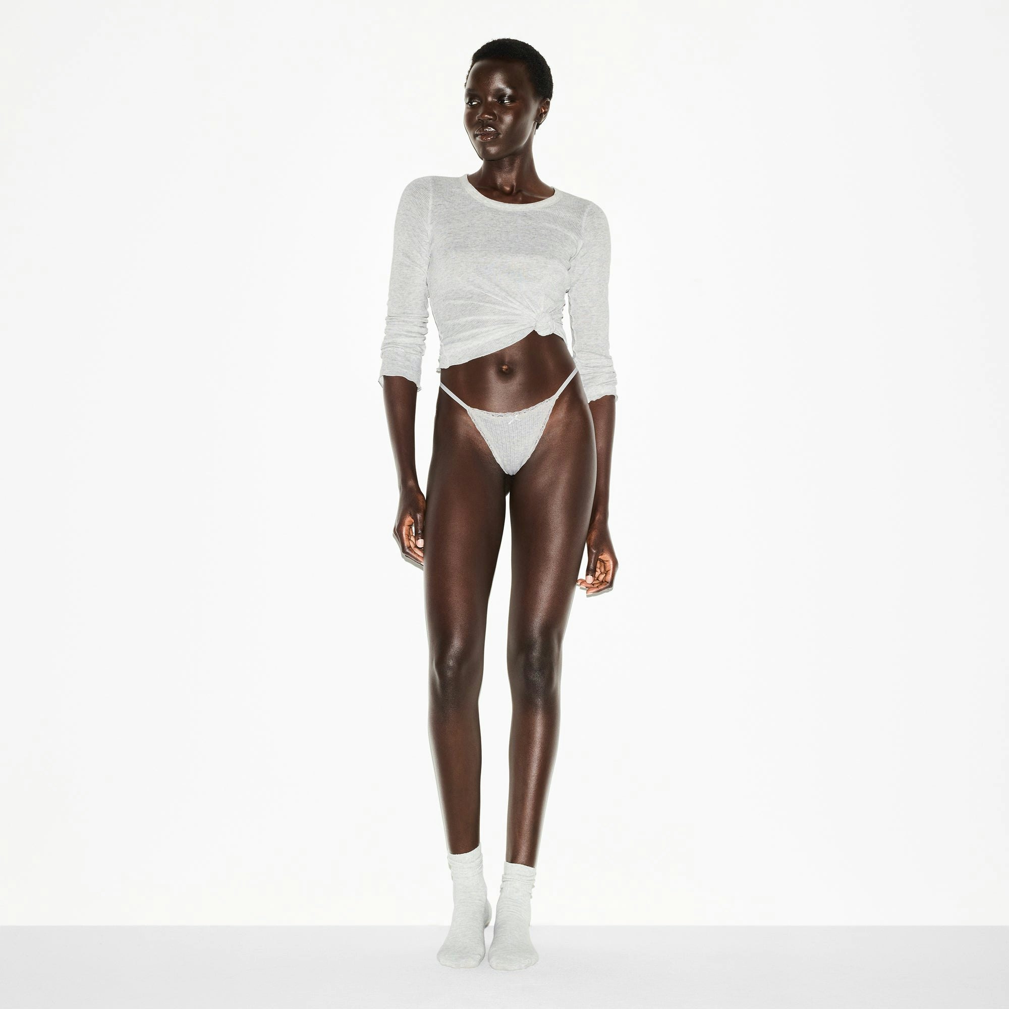 LIGHTWEIGHT COTTON POINTELLE LACE STRING THONG | LIGHT HEATHER GREY ON A MODEL FRONT VIEW @ | FOCUS: 0.0, 1.0, 0.9