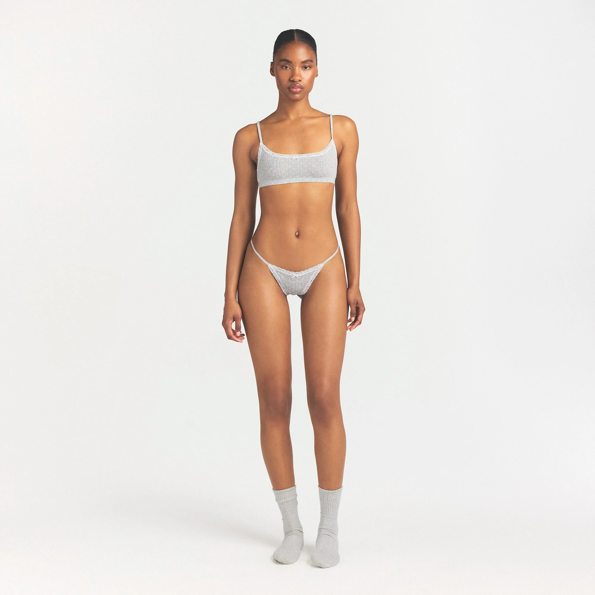 LIGHTWEIGHT COTTON POINTELLE LACE STRING THONG | LIGHT HEATHER GREY PIN DOT ON A MODEL FRONT VIEW @ | FOCUS: 0.0, 1.0, 0.9