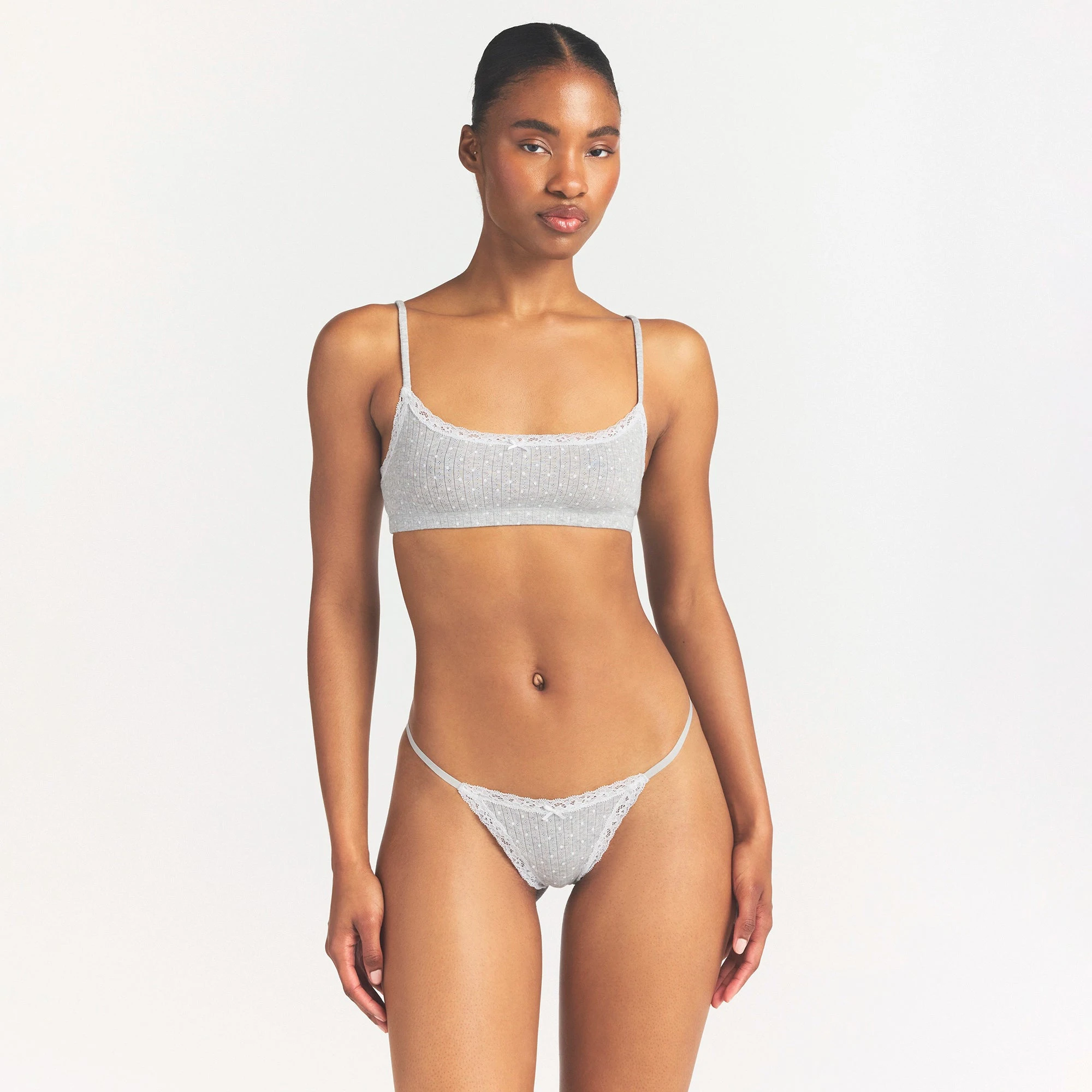 LIGHTWEIGHT COTTON POINTELLE LACE STRING THONG | LIGHT HEATHER GREY PIN DOT ON A MODEL SIDE VIEW @ | FOCUS: 0.0, 1.0, 0.9