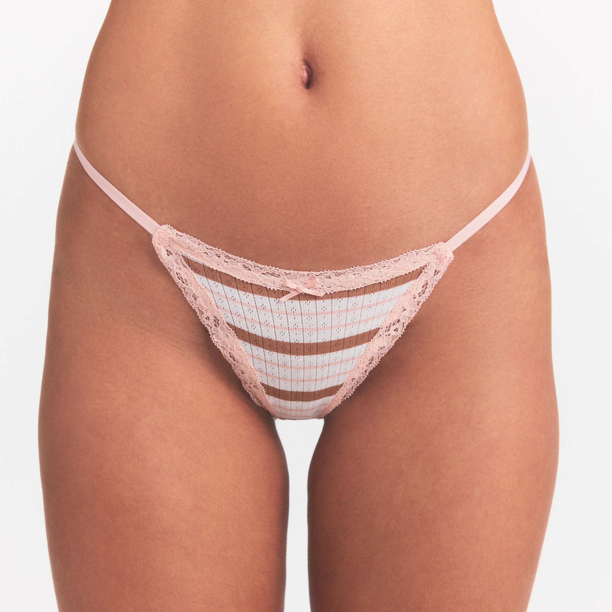 LIGHTWEIGHT COTTON POINTELLE LACE STRING THONG | VILLA EGRET RUNWAY STRIPE ON A MODEL SIDE VIEW @ | FOCUS: 0.0, 1.0, 0.9