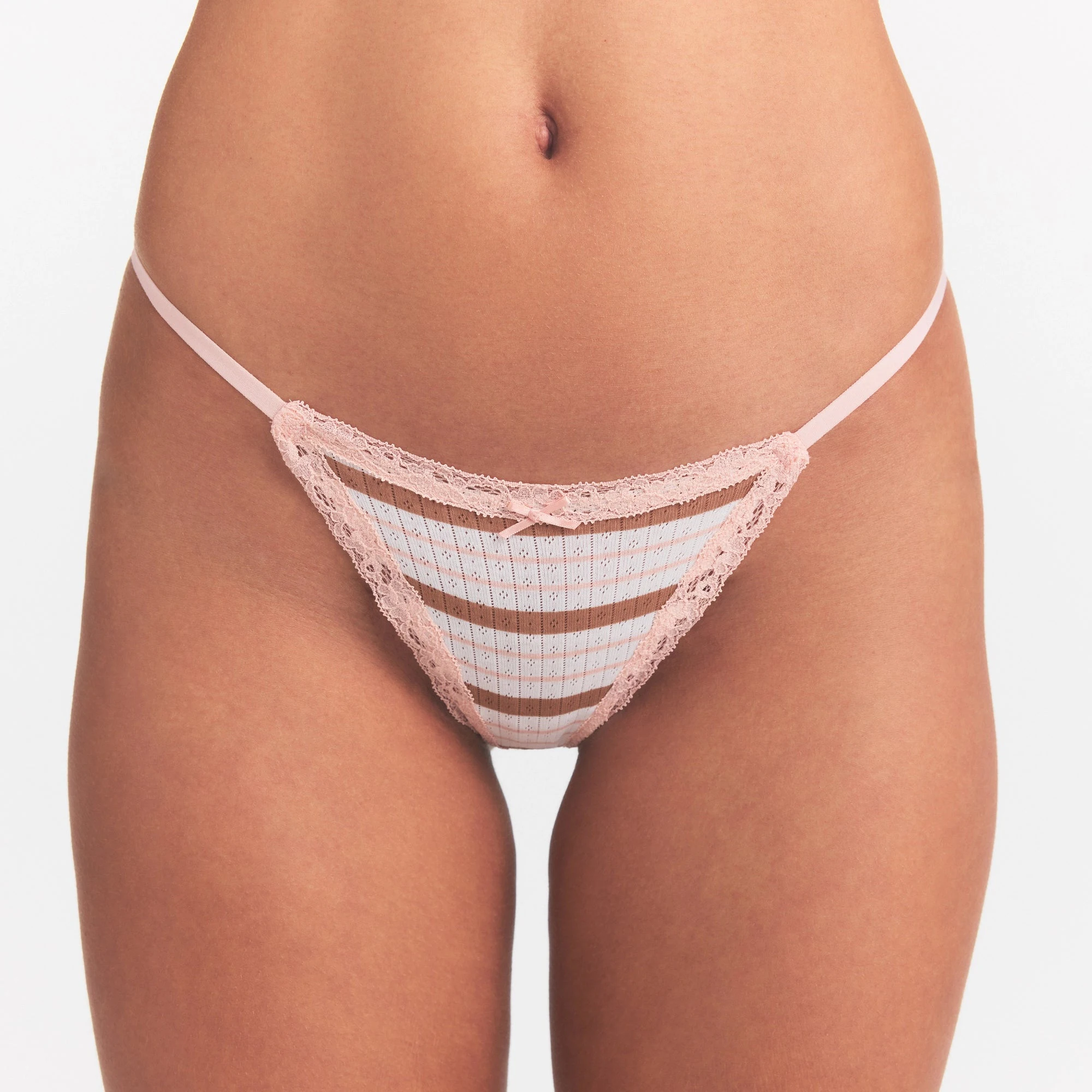 LIGHTWEIGHT COTTON POINTELLE LACE STRING THONG | VILLA EGRET RUNWAY STRIPE ON A MODEL SIDE VIEW @ | FOCUS: 0.0, 1.0, 0.9