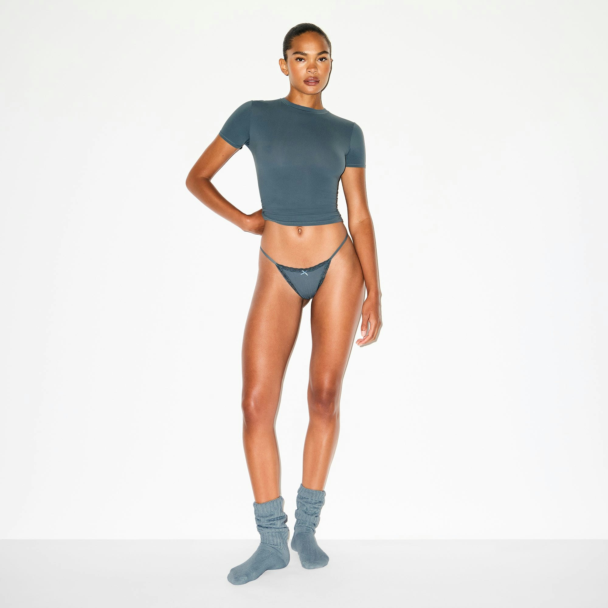 LIGHTWEIGHT COTTON POINTELLE LACE STRING THONG | ZIRCON TONAL ON A MODEL FRONT VIEW @ | FOCUS: 0.0, 1.0, 0.9