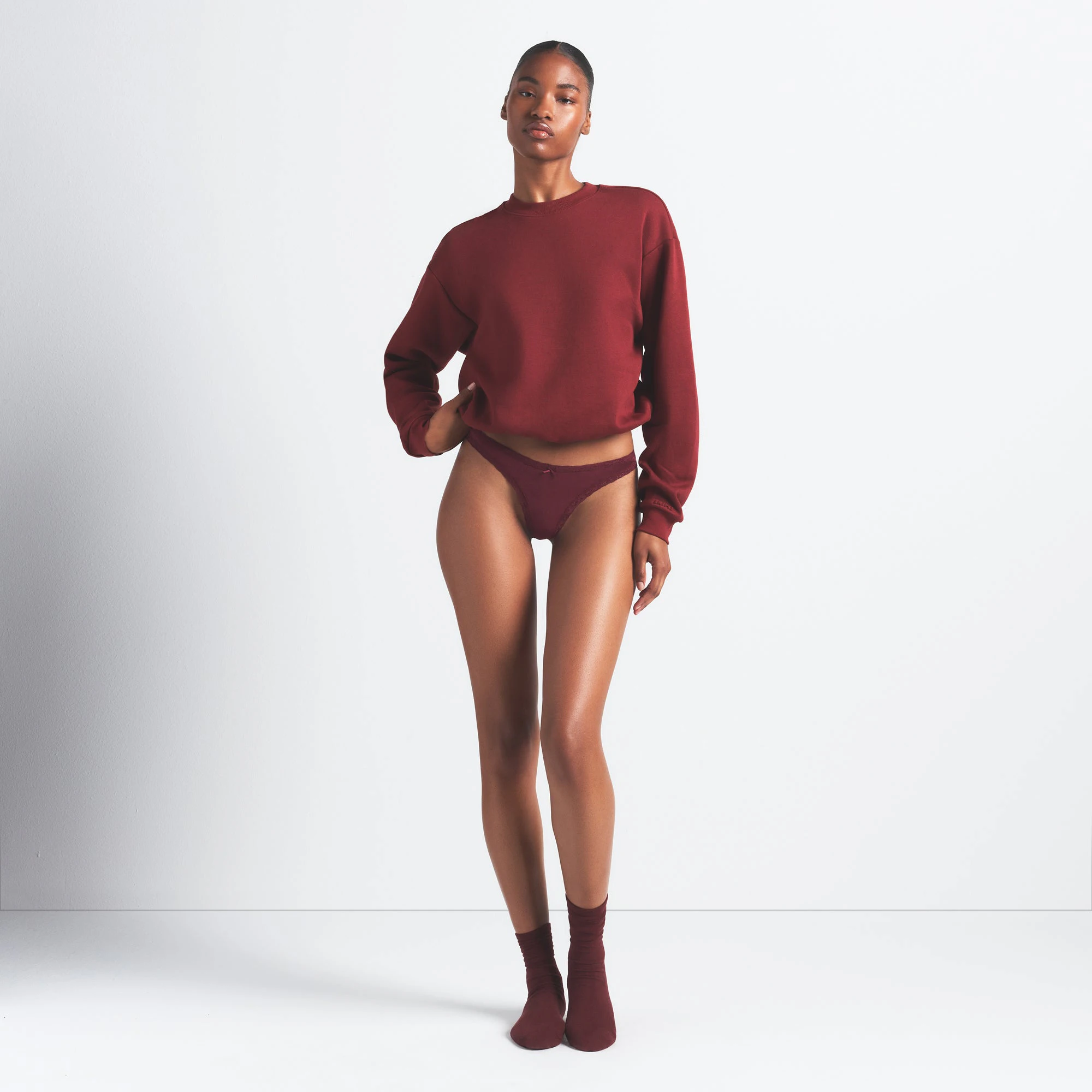 LIGHTWEIGHT COTTON LACE THONG 10-PACK | RED EMERALD MULTI ON A MODEL FRONT VIEW @ | FOCUS: 0.0, 1.0, 0.9