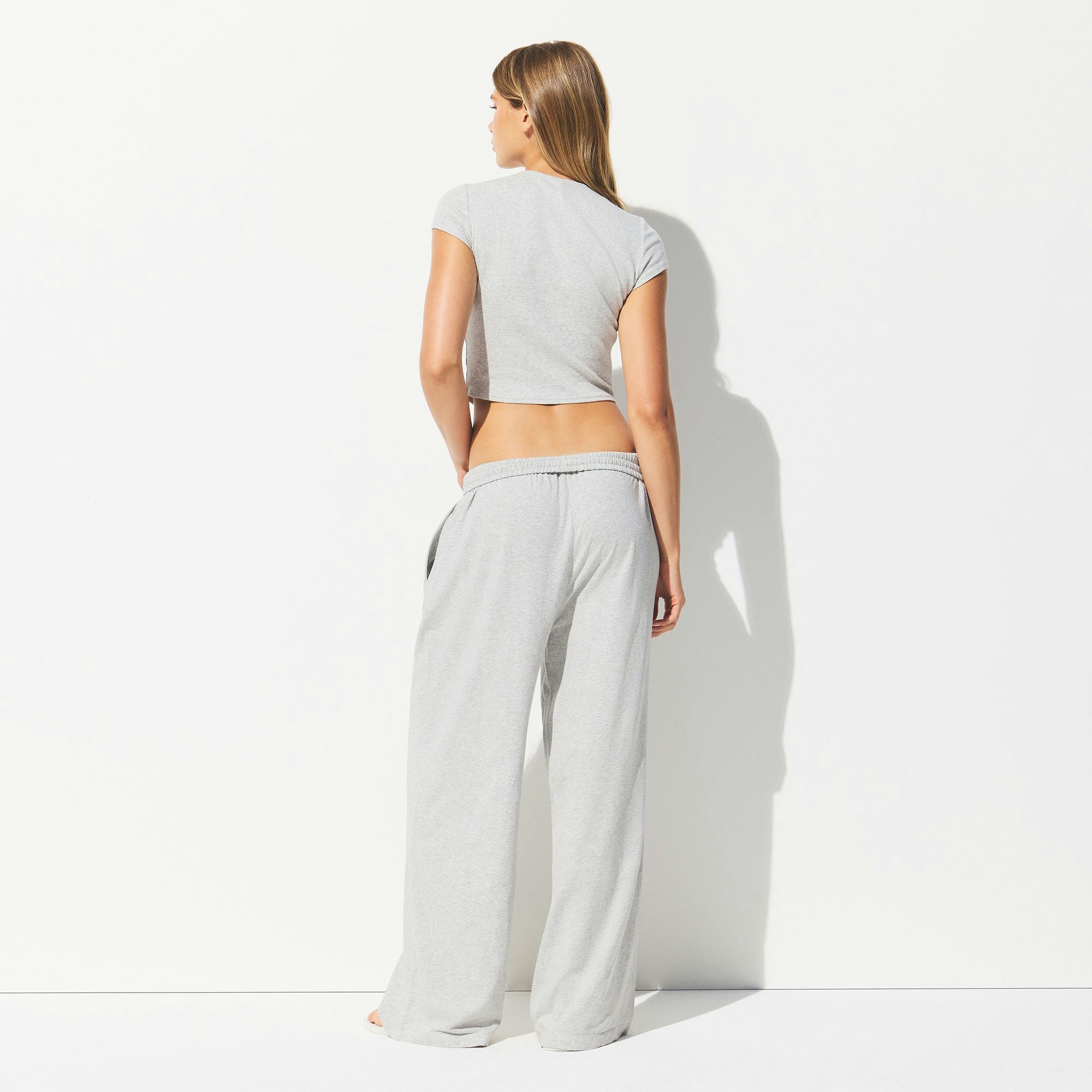 COTTON JERSEY WIDE LEG PANT | LIGHT HEATHER GREY ON A MODEL BACK VIEW @ | FOCUS: 0.0, 1.0, 0.9