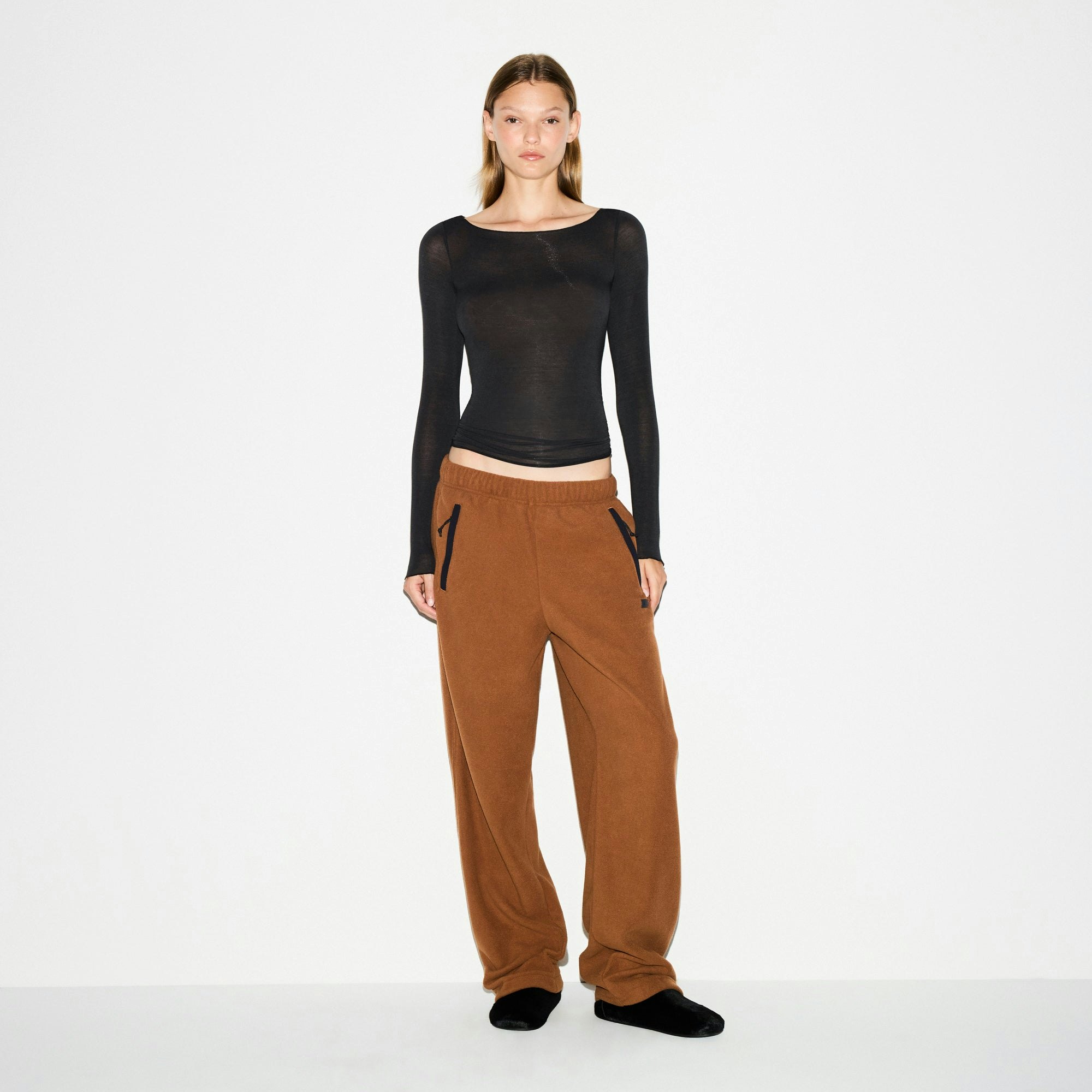 OUTDOOR FLEECE STRAIGHT LEG PANT | CHAI ON A MODEL FRONT VIEW @ | FOCUS: 0.0, 1.0, 0.9