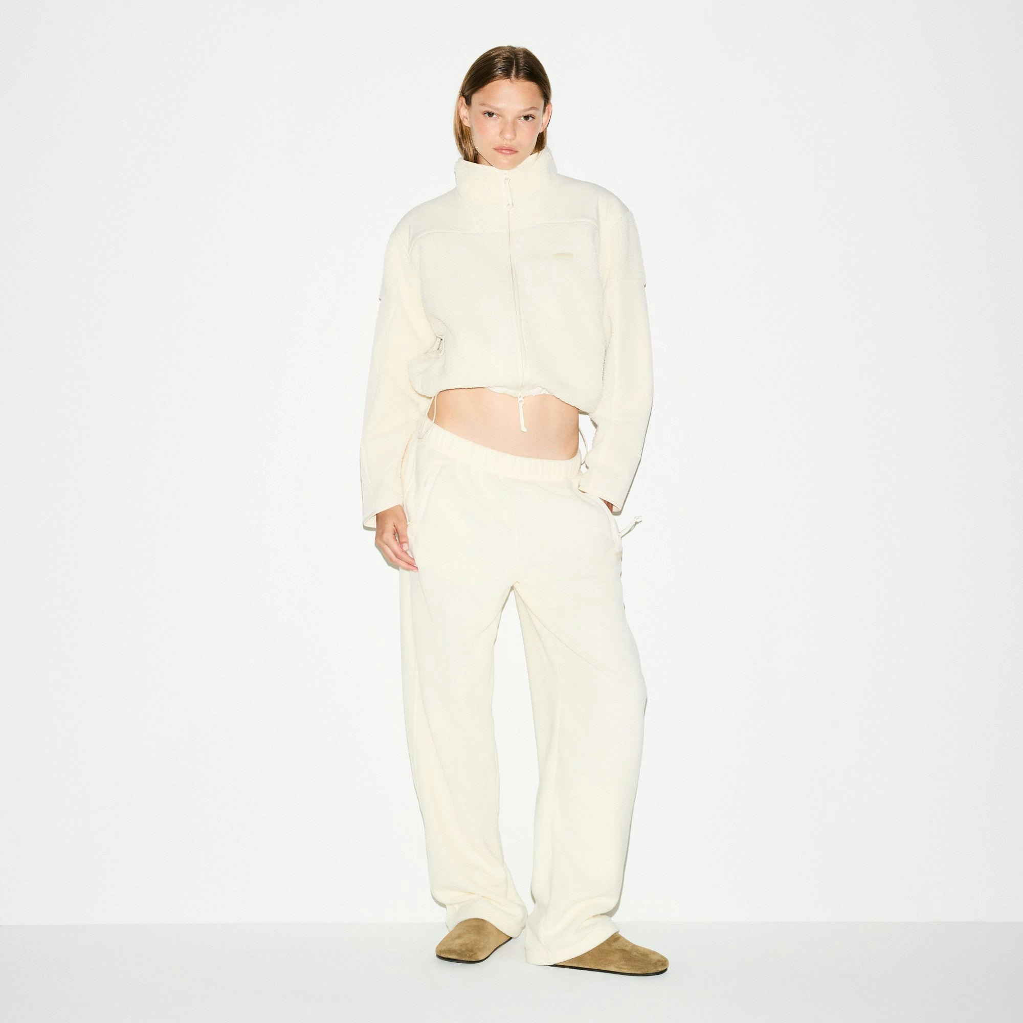 OUTDOOR FLEECE STRAIGHT LEG PANT | ECRU ON A MODEL FRONT VIEW @ | FOCUS: 0.0, 1.0, 0.9