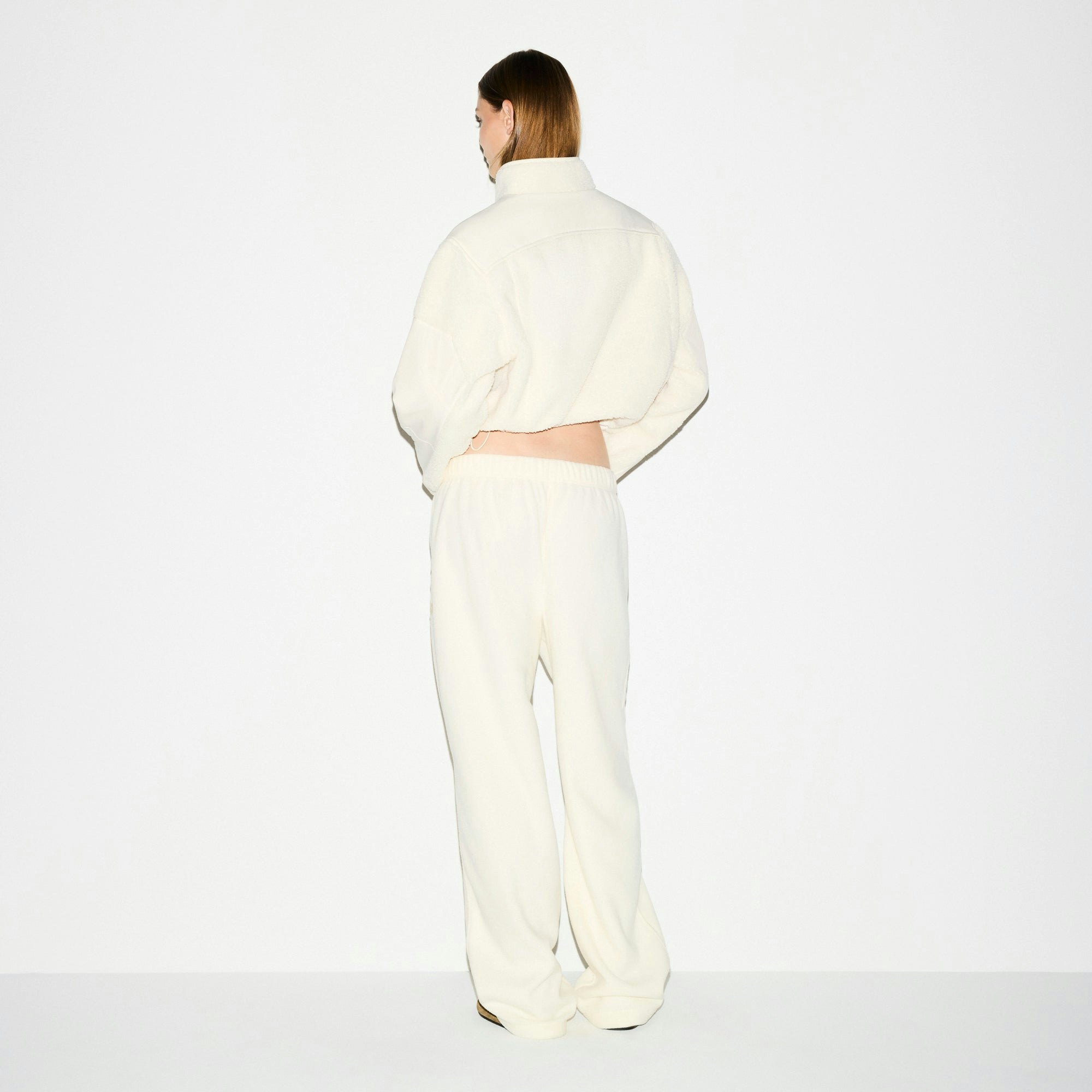 OUTDOOR FLEECE STRAIGHT LEG PANT | ECRU ON A MODEL SIDE VIEW @ | FOCUS: 0.0, 1.0, 0.9