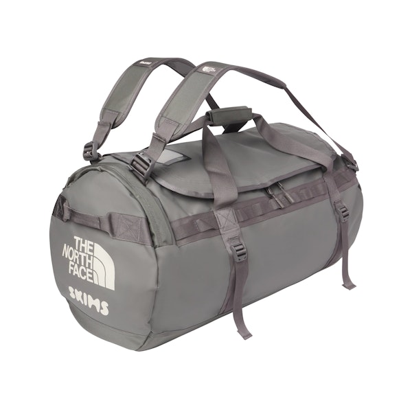THE NORTH FACE X SKIMS LARGE BASE CAMP DUFFLE BAG | GUNMETAL FLAT ON A WHITE BACKGROUND | FLT