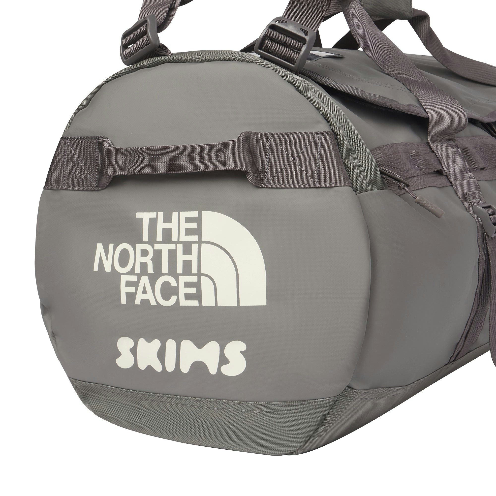 THE NORTH FACE X SKIMS LARGE BASE CAMP DUFFLE BAG | GUNMETAL FLAT ON A WHITE BACKGROUND