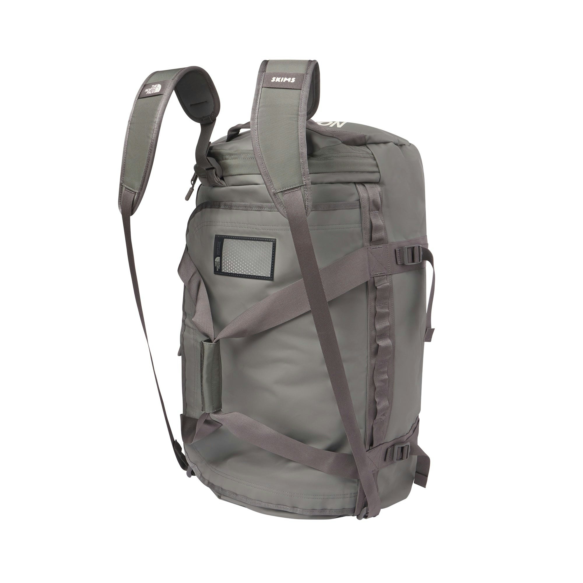 THE NORTH FACE X SKIMS LARGE BASE CAMP DUFFLE BAG | GUNMETAL FLAT ON A WHITE BACKGROUND