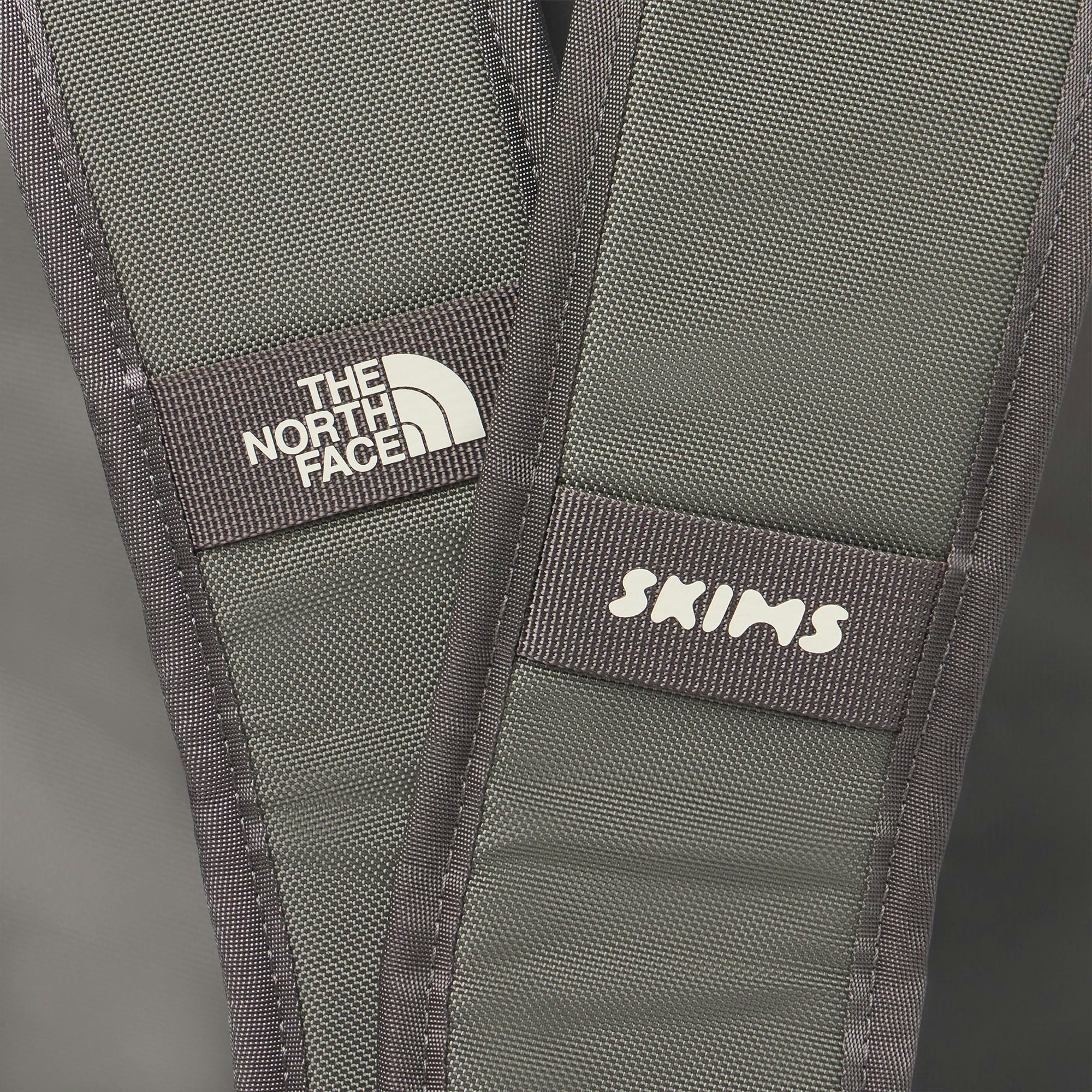 THE NORTH FACE X SKIMS LARGE BASE CAMP DUFFLE BAG | GUNMETAL FLAT ON A WHITE BACKGROUND