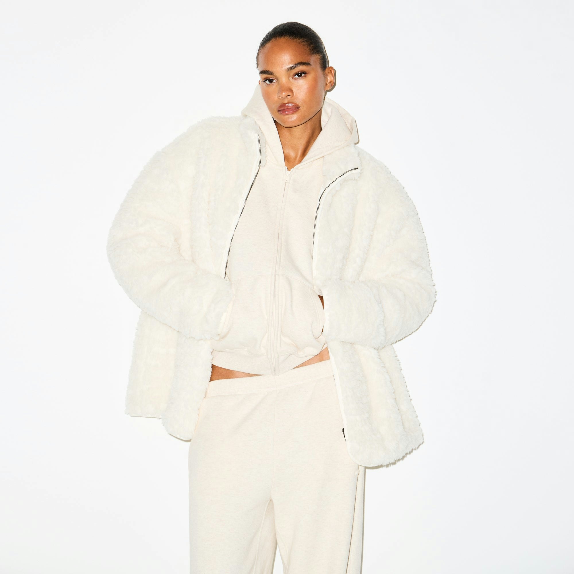 FAUX FUR OVERSIZED MOCK NECK JACKET | EGRET ON A MODEL SIDE VIEW @ | FOCUS: 0.0, 1.0, 0.9