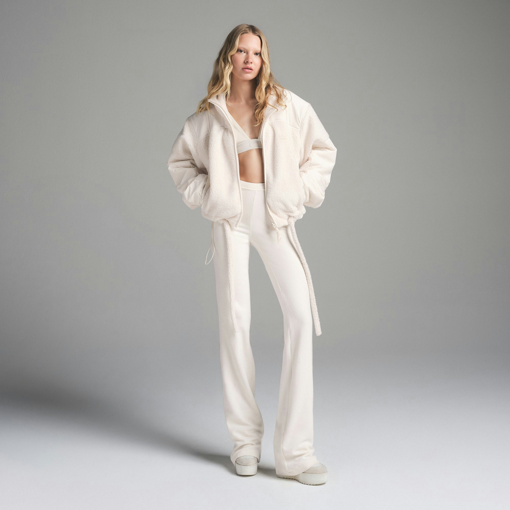 TEDDY BOXY ZIP UP | ECRU ON A MODEL FRONT VIEW| FOCUS: 0.9, 0.9, 0.9
