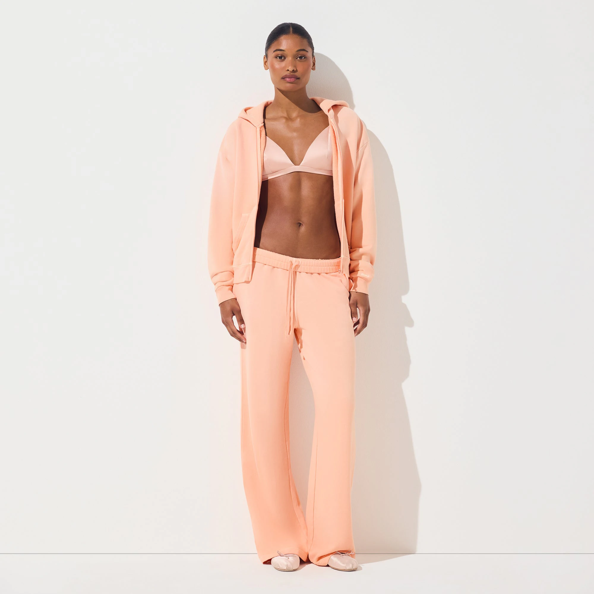 FRENCH TERRY ZIP UP HOODIE | CANTALOUPE ON A MODEL FRONT VIEW | FOCUS: 0.0, 1.0, 0.9