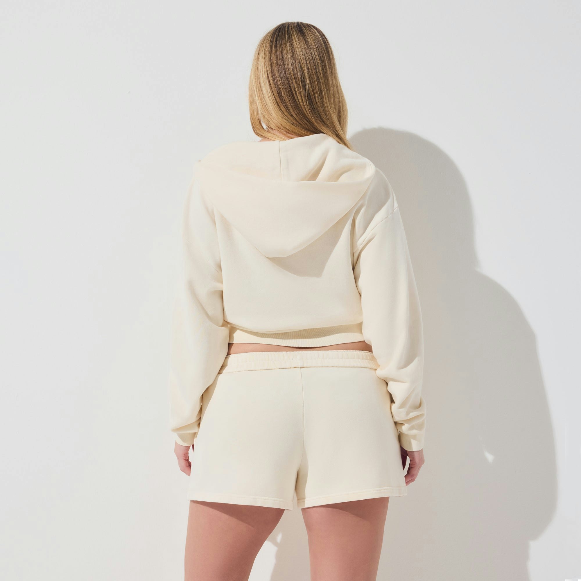 FRENCH TERRY ZIP UP HOODIE | ECRU ON A MODEL SIDE VIEW | FOCUS: 0.0, 1.0, 0.9