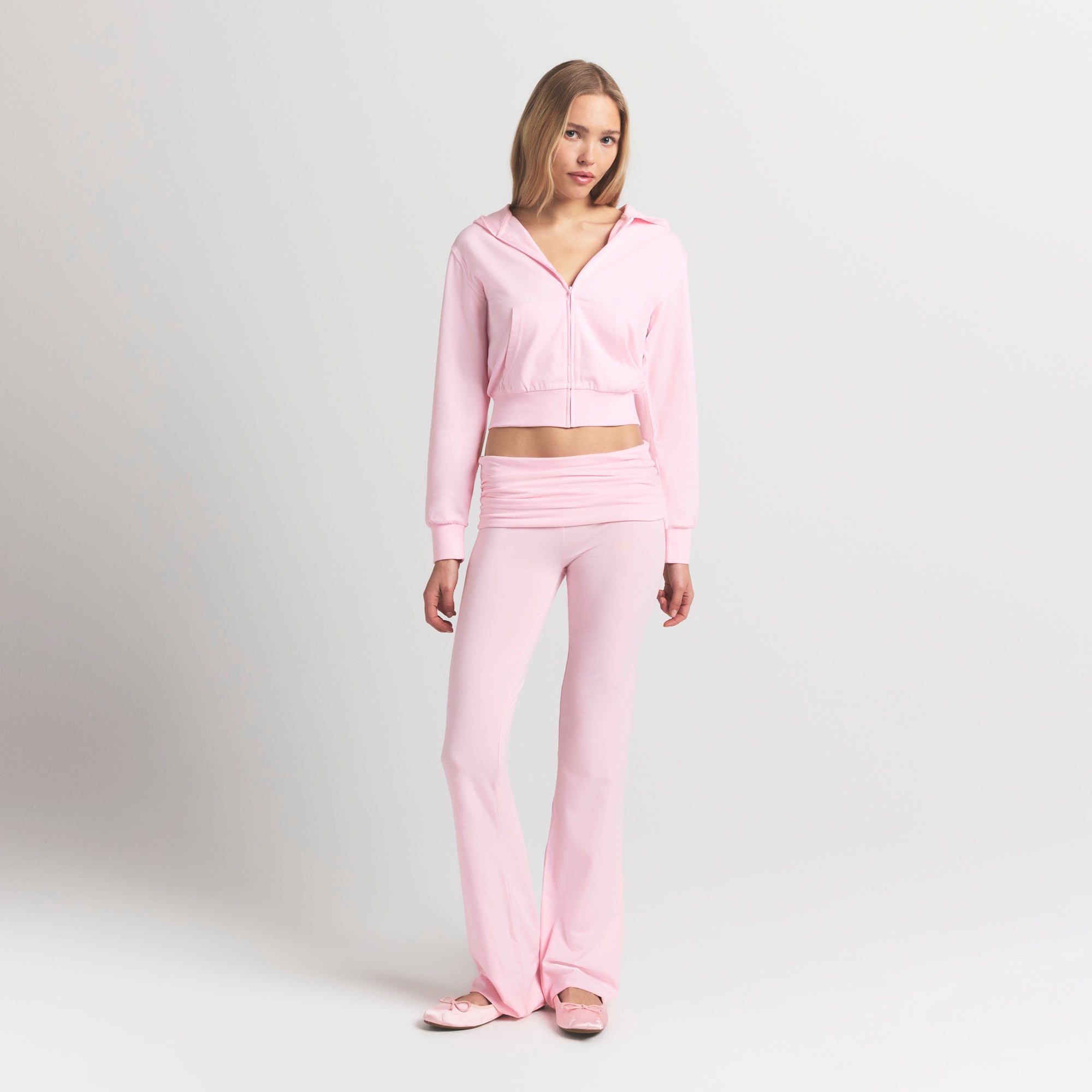 COTTON JERSEY ZIP UP HOODIE | CHERRY BLOSSOM ON A MODEL FRONT VIEW @ | FOCUS: 0.9, 0.1, 0.7