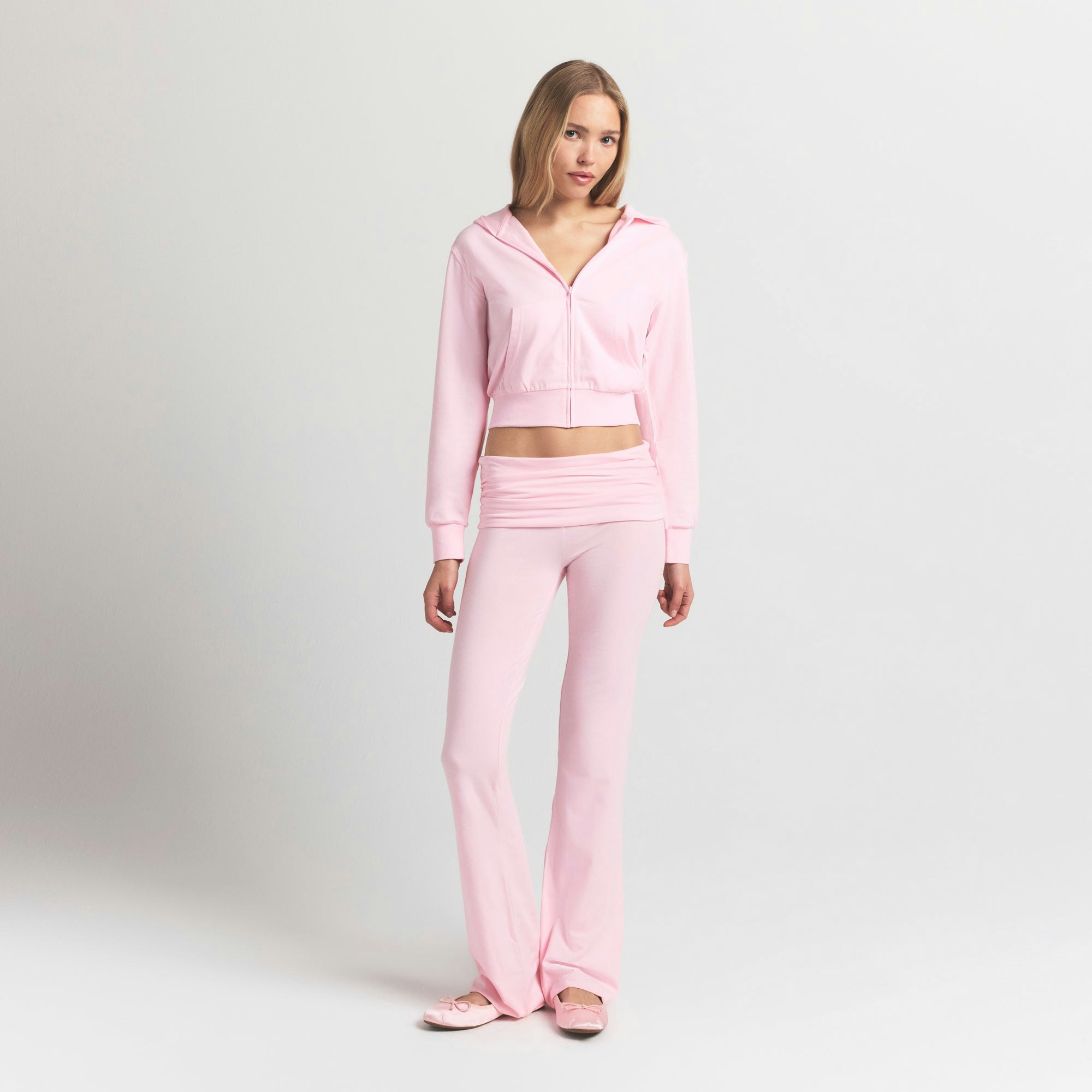 COTTON JERSEY ZIP UP HOODIE | CHERRY BLOSSOM ON A MODEL FRONT VIEW @ | FOCUS: 0.9, 0.1, 0.7