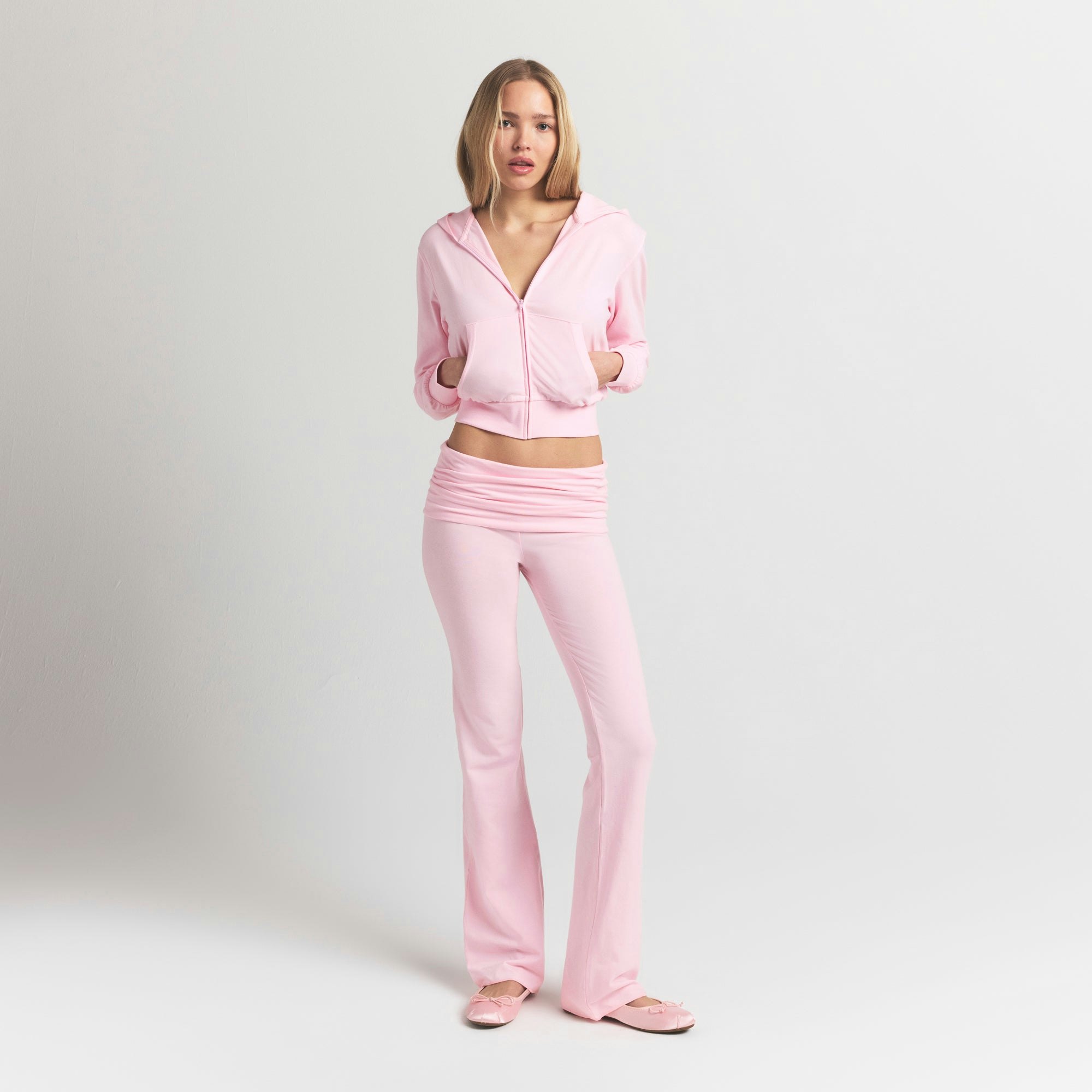 COTTON JERSEY ZIP UP HOODIE | CHERRY BLOSSOM ON A MODEL FRONT VIEW @ | FOCUS: 0.9, 0.1, 0.7