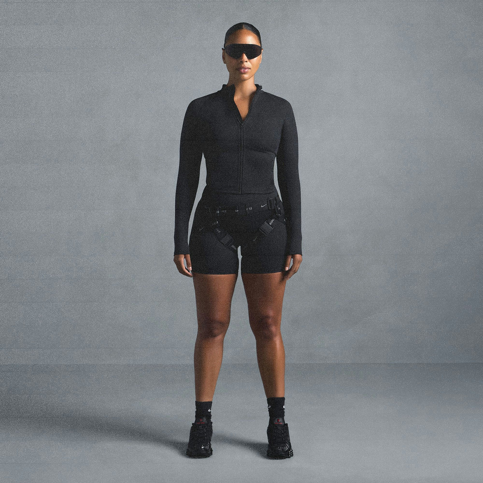 NikeSKIMS MATTE MOCK NECK FULL ZIP JACKET | OBSIDIAN ON A MODEL SIDE VIEW @ | FOCUS: 0.0, 1.0, 0.9