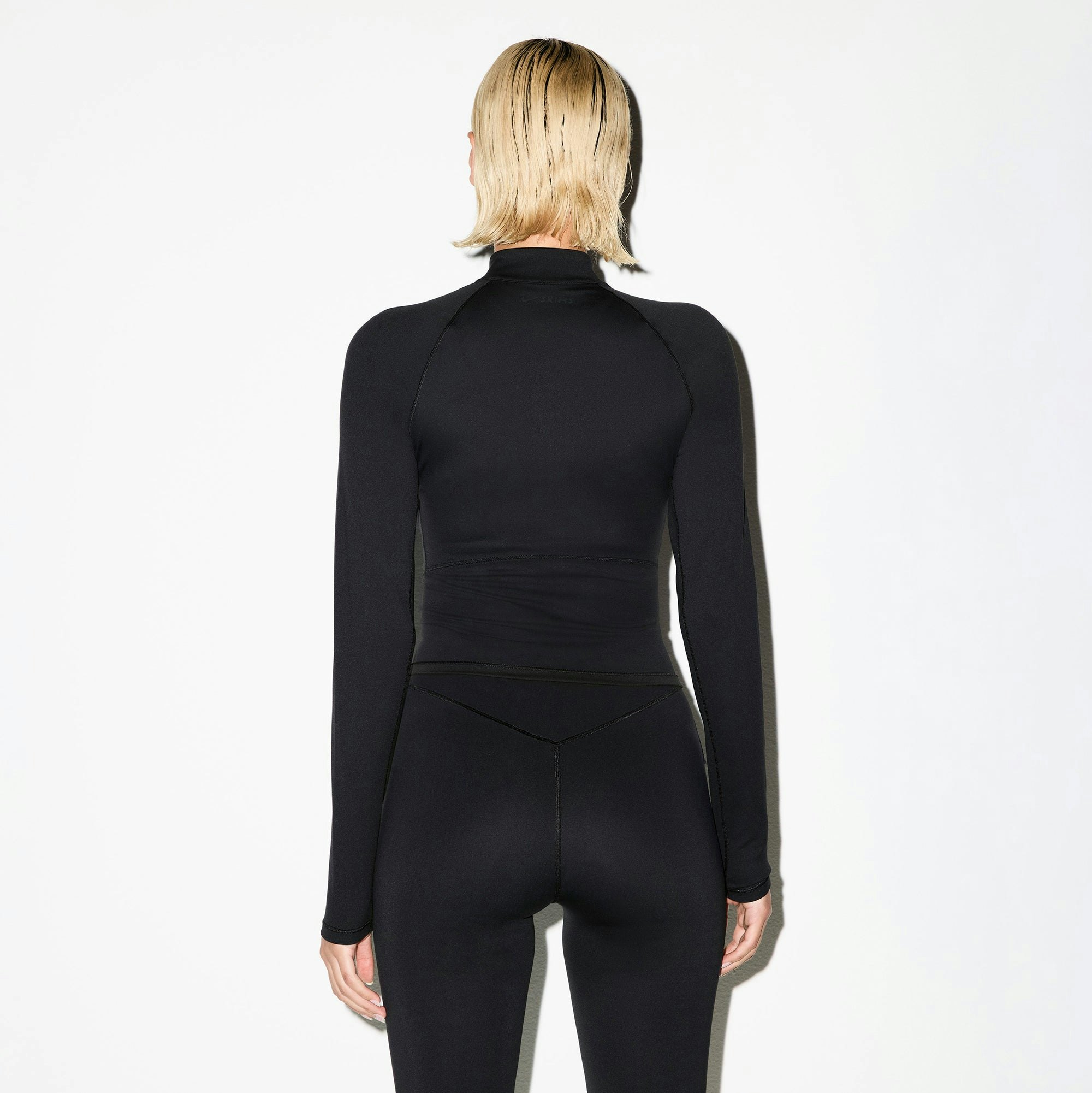 NikeSKIMS MATTE MOCK NECK FULL ZIP JACKET | OBSIDIAN ON A MODEL BACK VIEW @ | FOCUS: 0.0, 1.0, 0.9