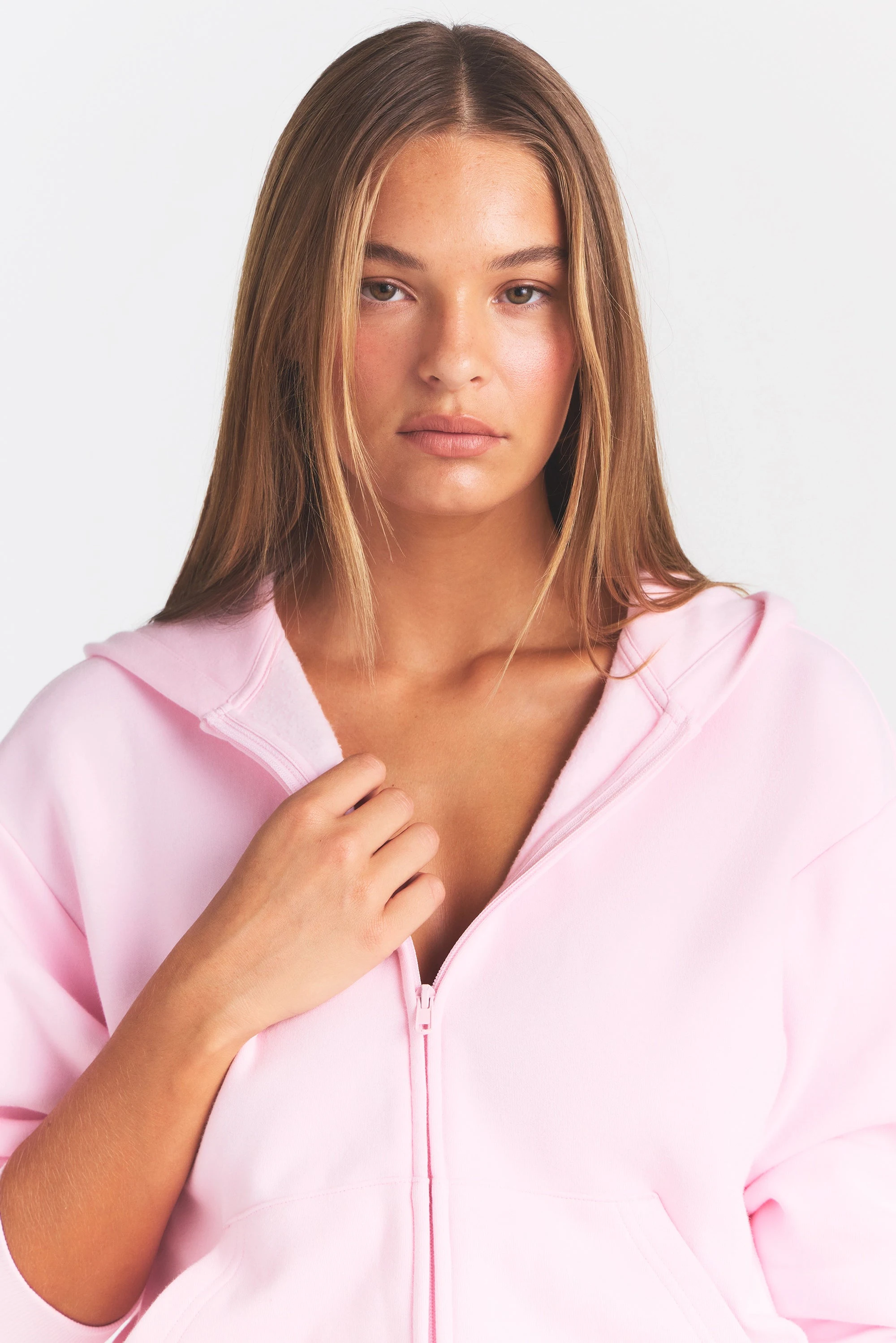 COTTON FLEECE CLASSIC ZIP UP HOODIE | CHERRY BLOSSOM ON A MODEL SIDE VIEW