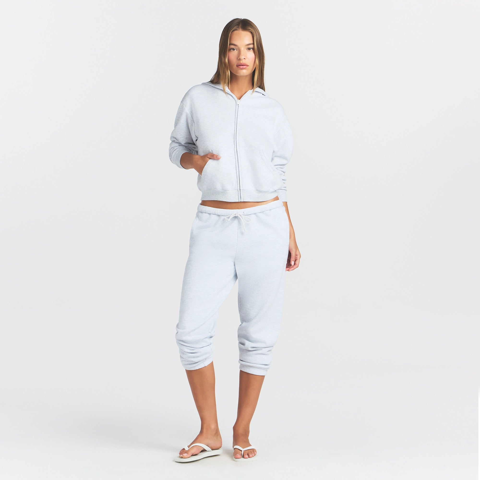COTTON FLEECE CLASSIC ZIP UP HOODIE | LIGHT HEATHER GREY ON A MODEL FRONT VIEW
