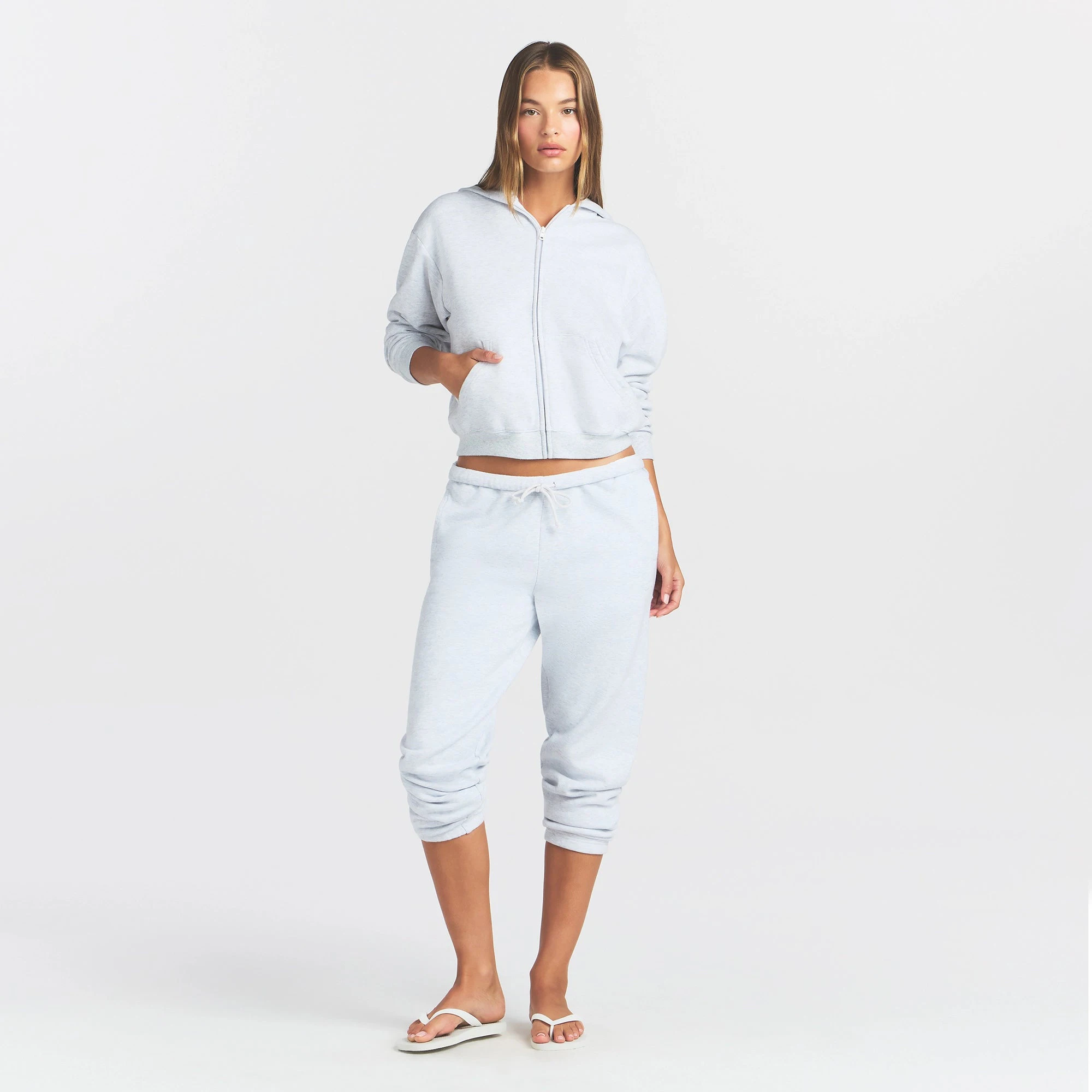 COTTON FLEECE CLASSIC ZIP UP HOODIE | LIGHT HEATHER GREY ON A MODEL FRONT VIEW