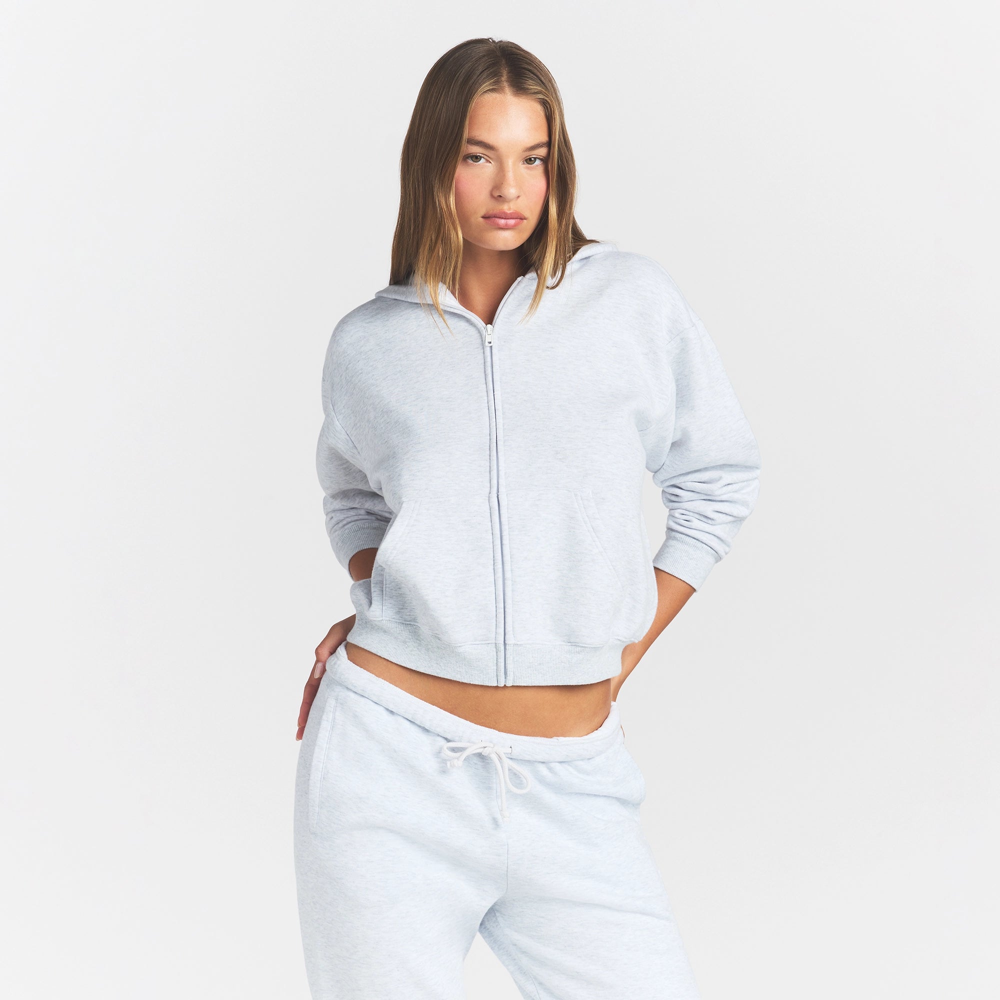 COTTON FLEECE CLASSIC ZIP UP HOODIE | LIGHT HEATHER GREY ON A MODEL FRONT VIEW @ | FOCUS: 0.0, 1.0, 0.9