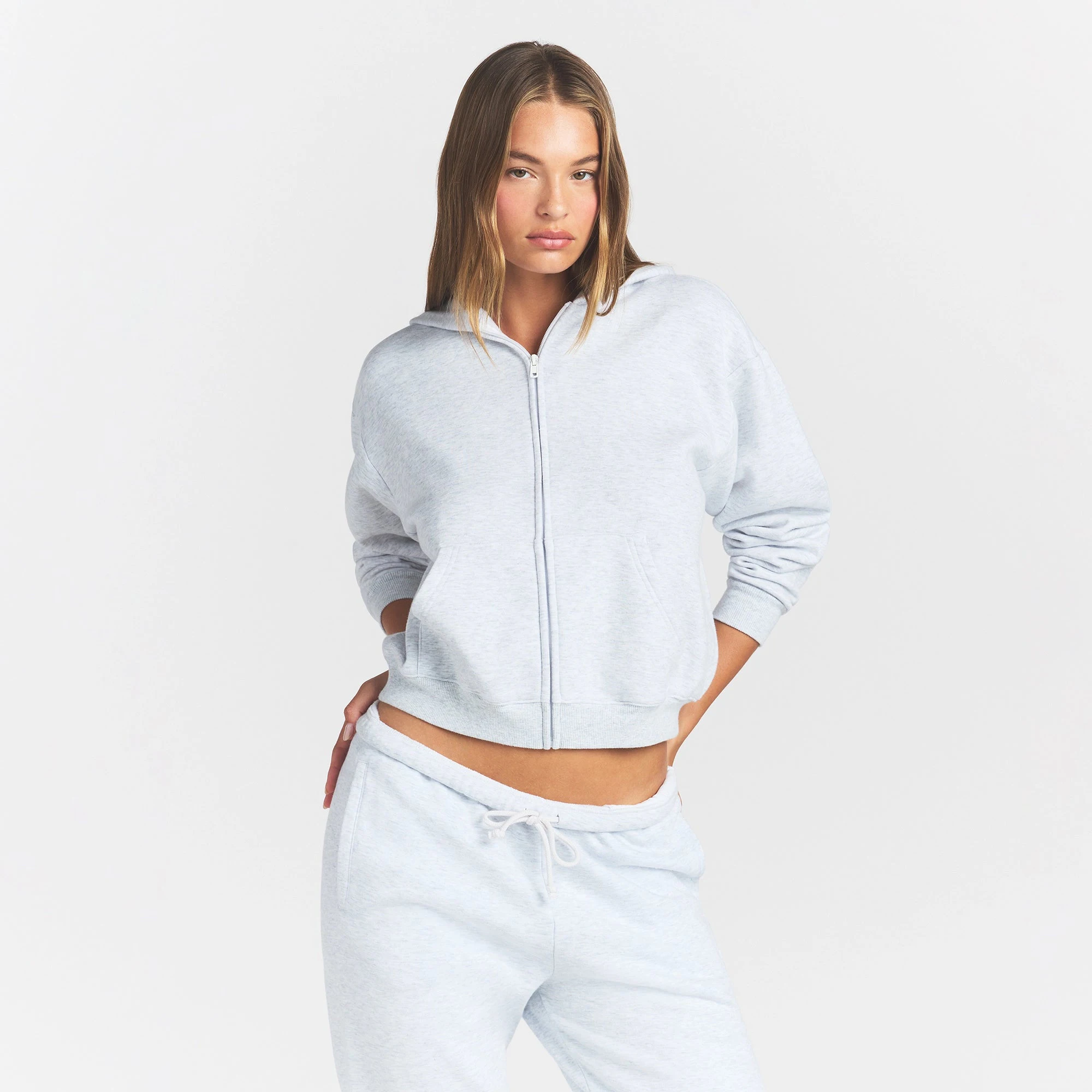 COTTON FLEECE CLASSIC ZIP UP HOODIE | LIGHT HEATHER GREY ON A MODEL FRONT VIEW