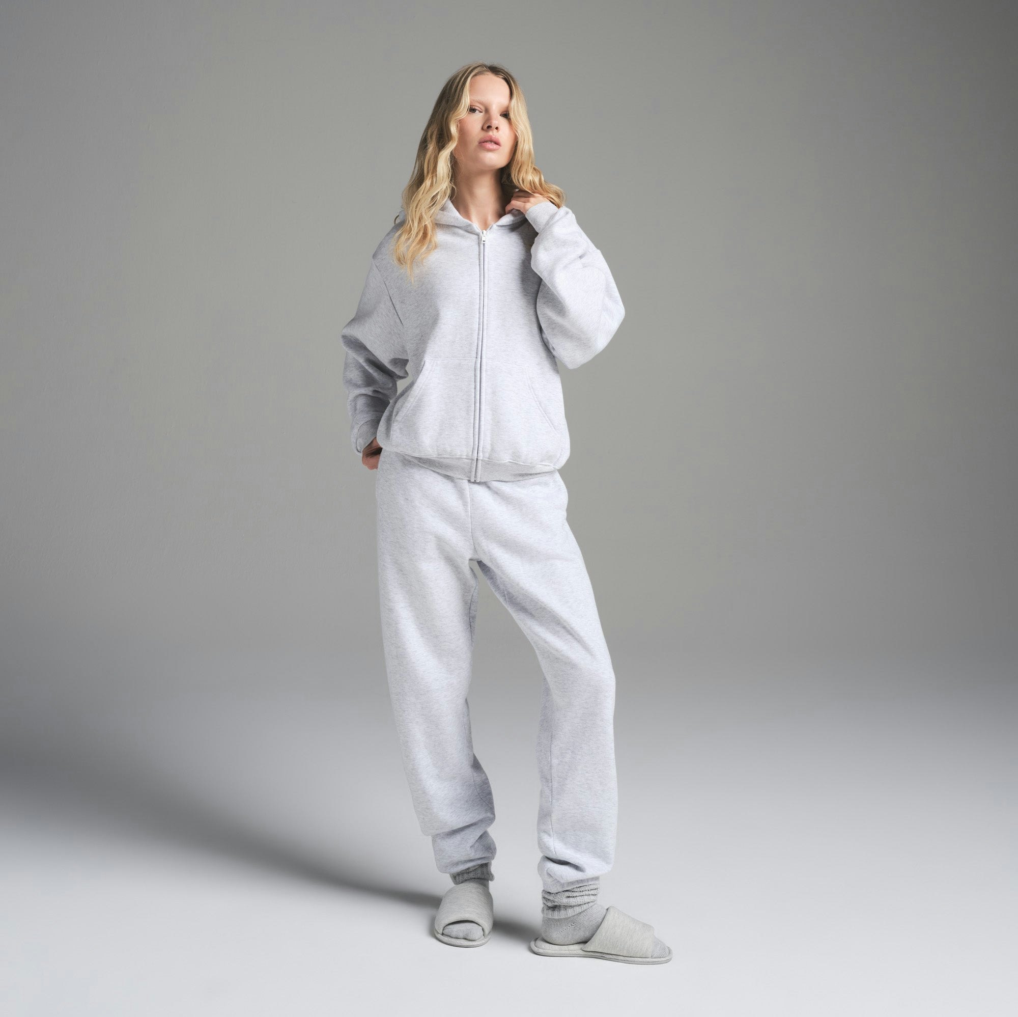 COTTON FLEECE CLASSIC ZIP UP HOODIE | LIGHT HEATHER GREY ON A MODEL FRONT VIEW | FOCUS: 0.0, 1.0, 0.9