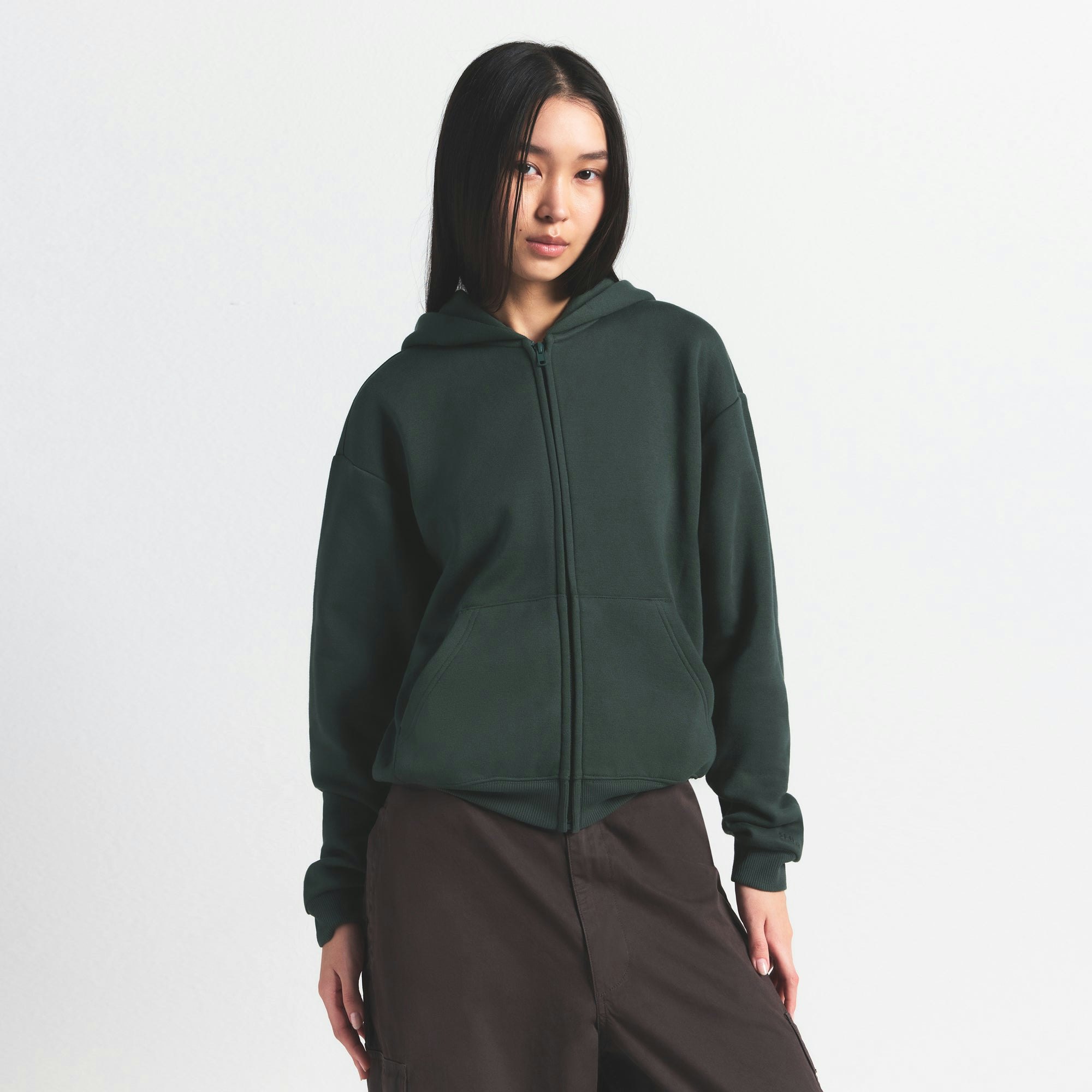 COTTON FLEECE CLASSIC ZIP UP HOODIE | SPRUCE ON A MODEL SIDE VIEW @ | FOCUS: 0.0, 1.0, 0.9