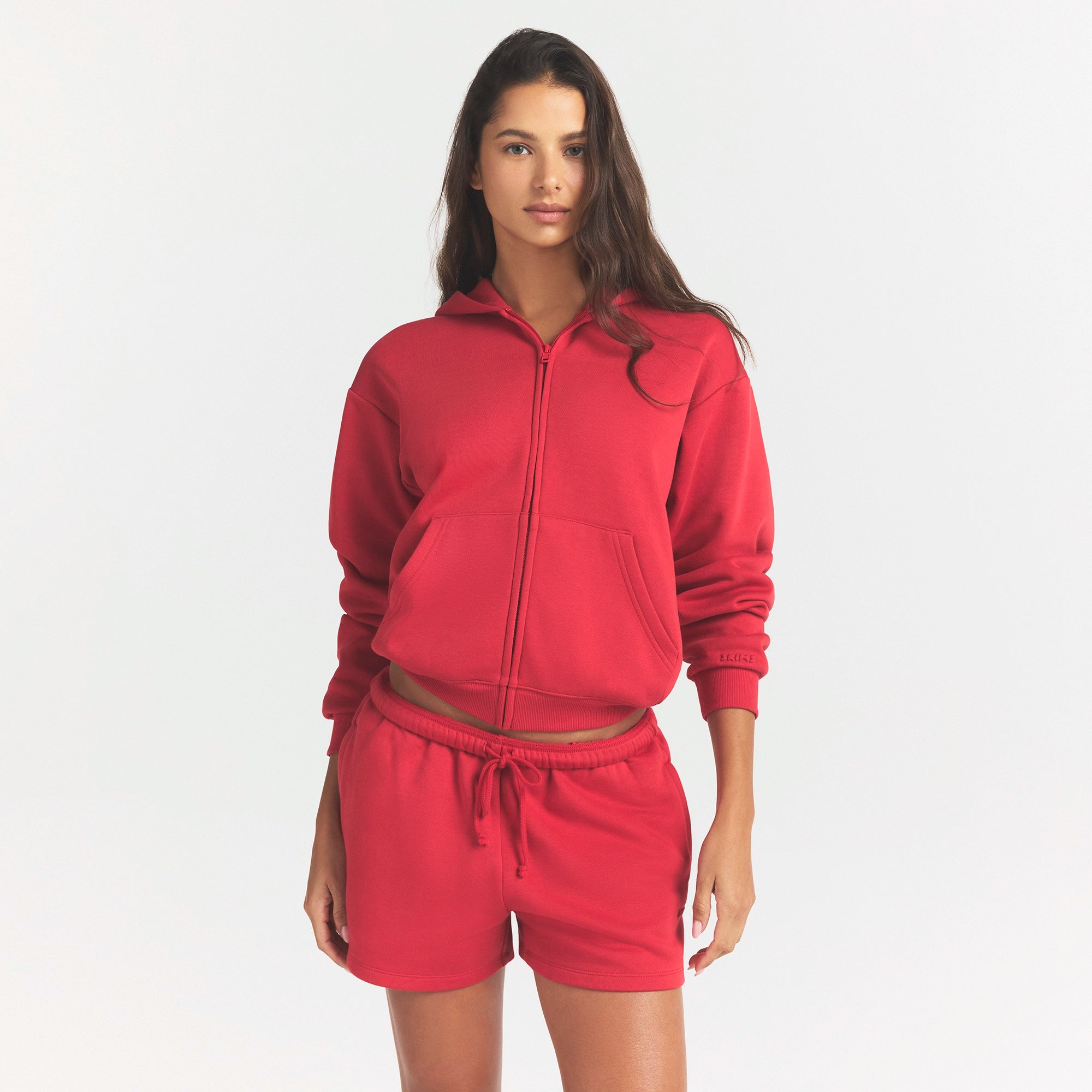 COTTON FLEECE CLASSIC ZIP UP HOODIE | WASHED RED ON A MODEL SIDE VIEW @ | FOCUS: 0.0, 1.0, 0.9