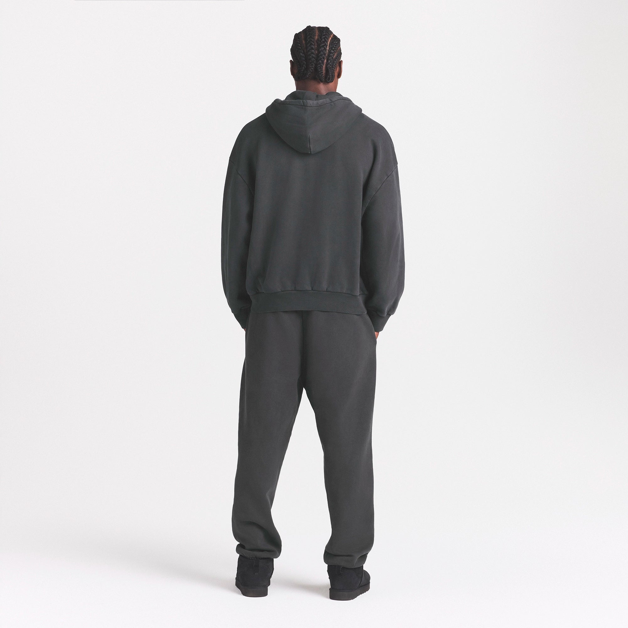 HEAVYWEIGHT FLEECE ZIP UP HOODIE | WASHED ONYX ON A MODEL SIDE VIEW