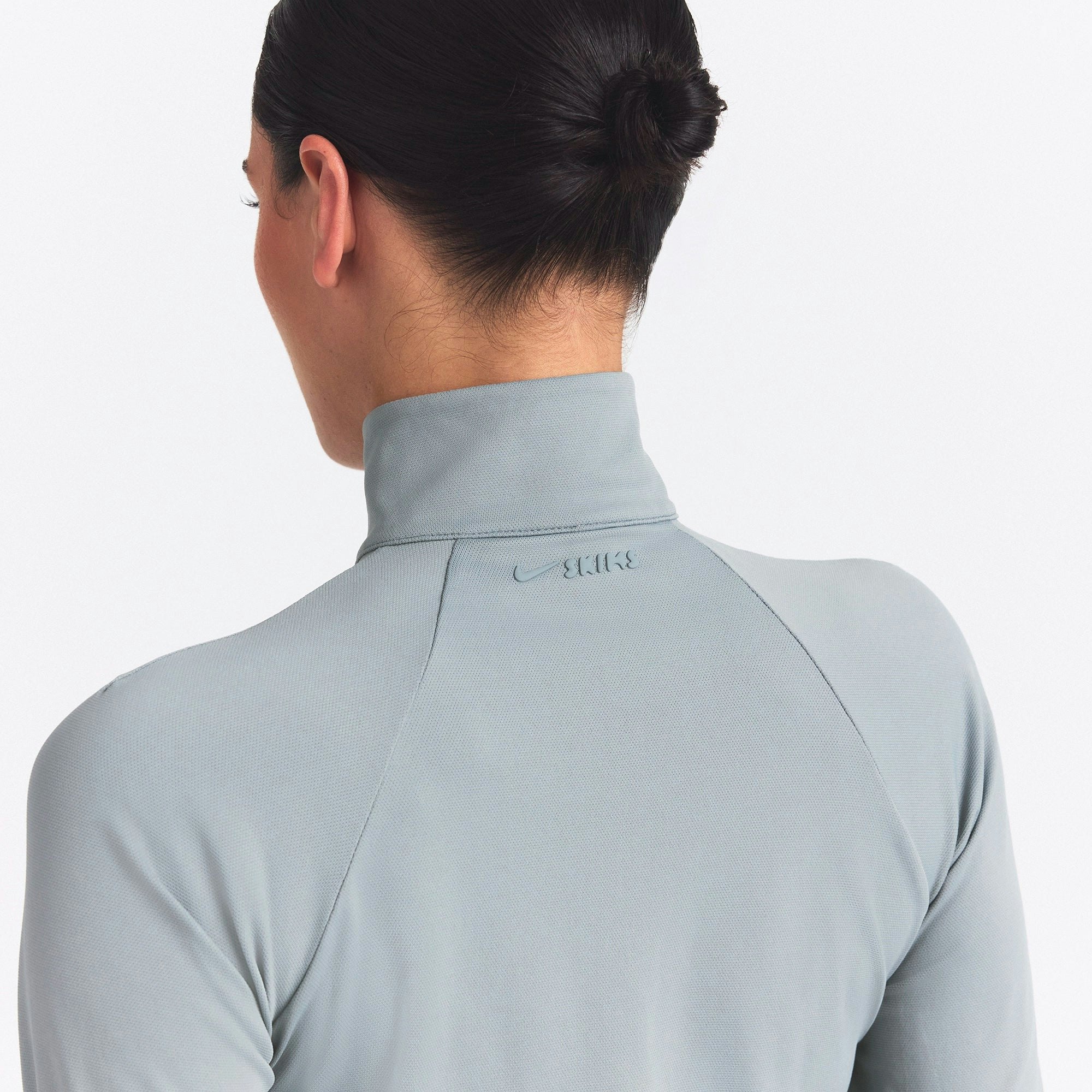 NikeSKIMS AIRY TRACK JACKET | WASHED PACIFIC ON A MODEL SIDE VIEW @ | FOCUS: 0.0, 1.0, 0.9