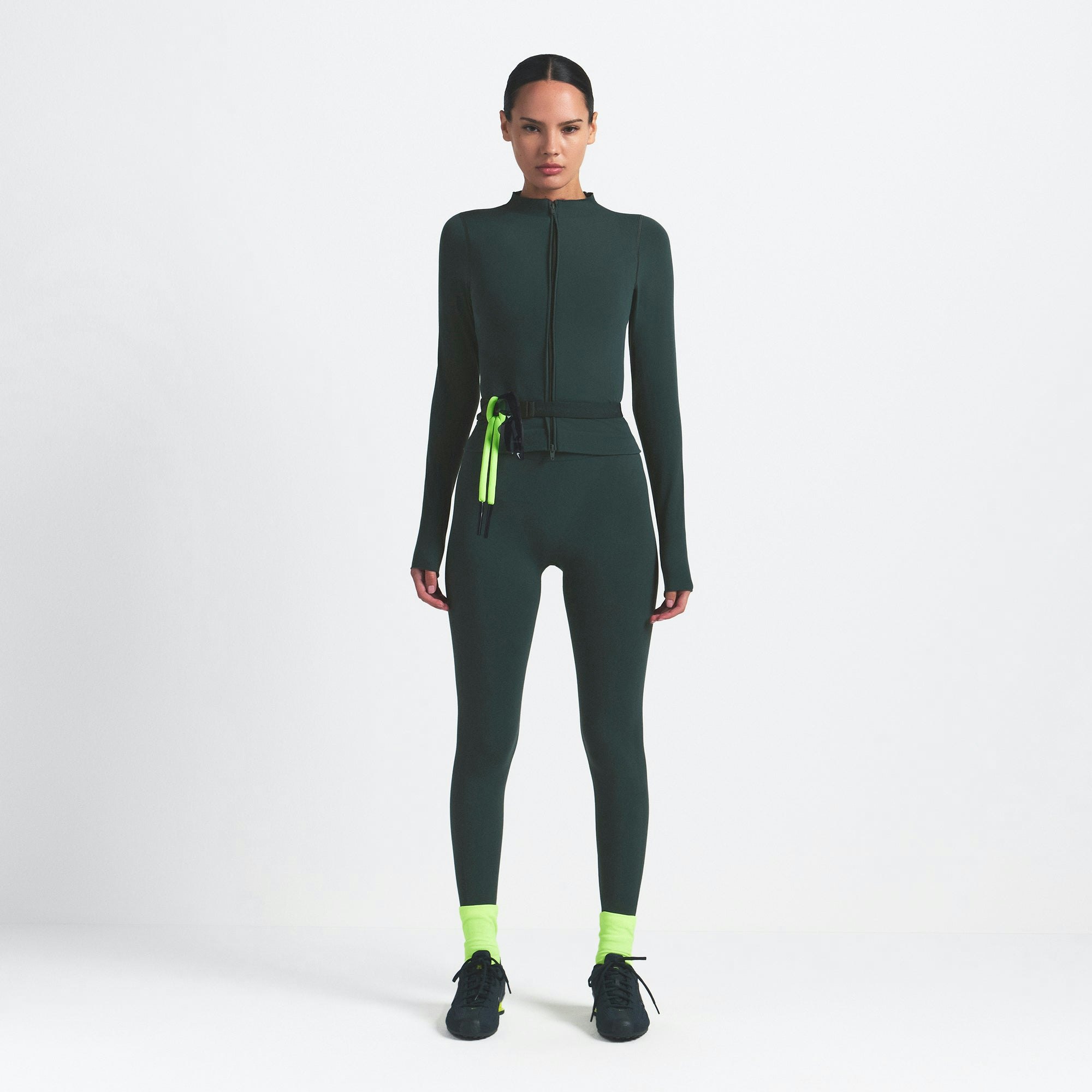 NikeSKIMS VINTAGE SEAMLESS FULL ZIP JACKET | DARK TEAL ON A MODEL FRONT VIEW @ | FOCUS: 0.0, 1.0, 0.9