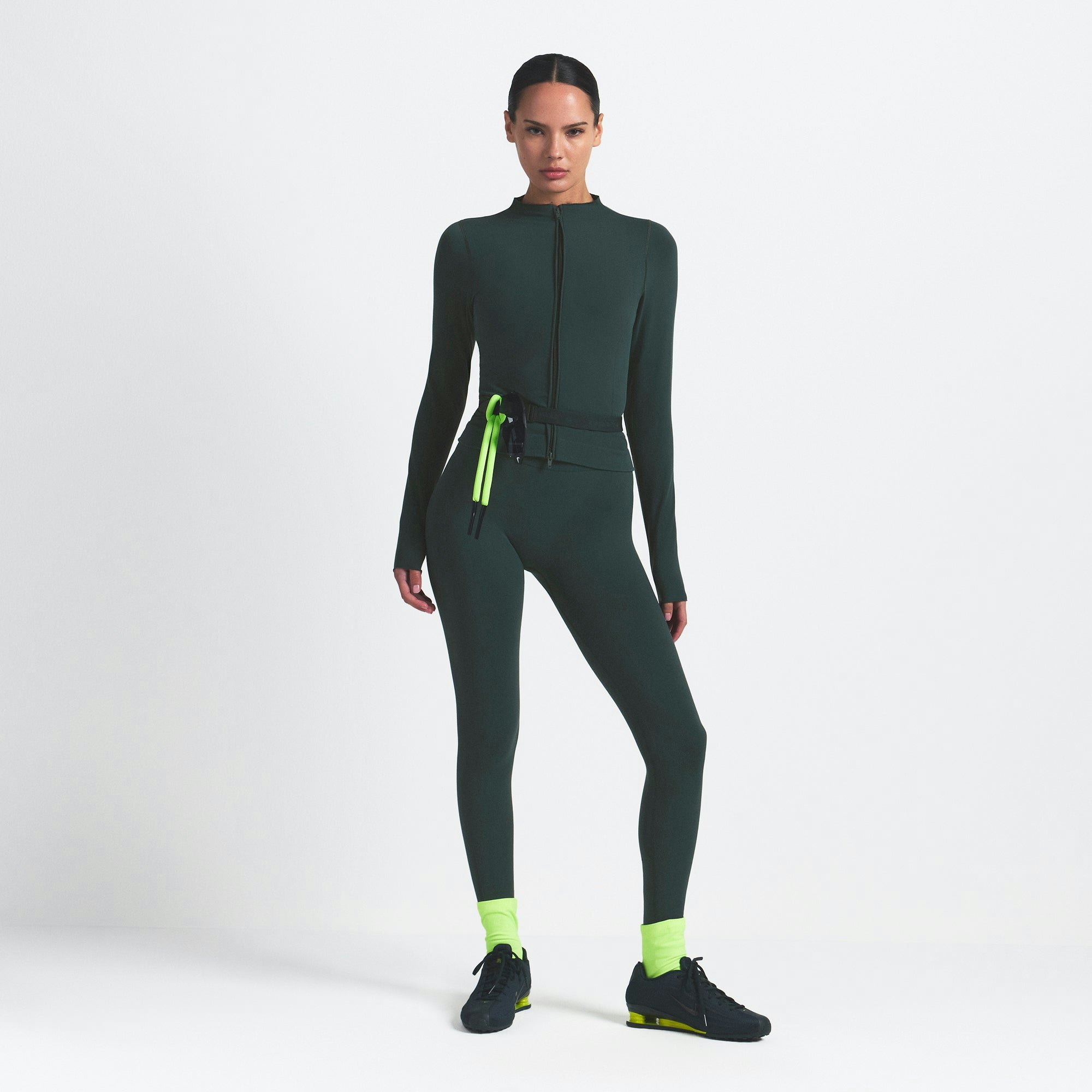 NikeSKIMS VINTAGE SEAMLESS FULL ZIP JACKET | DARK TEAL ON A MODEL FRONT VIEW @ | FOCUS: 0.0, 1.0, 0.9