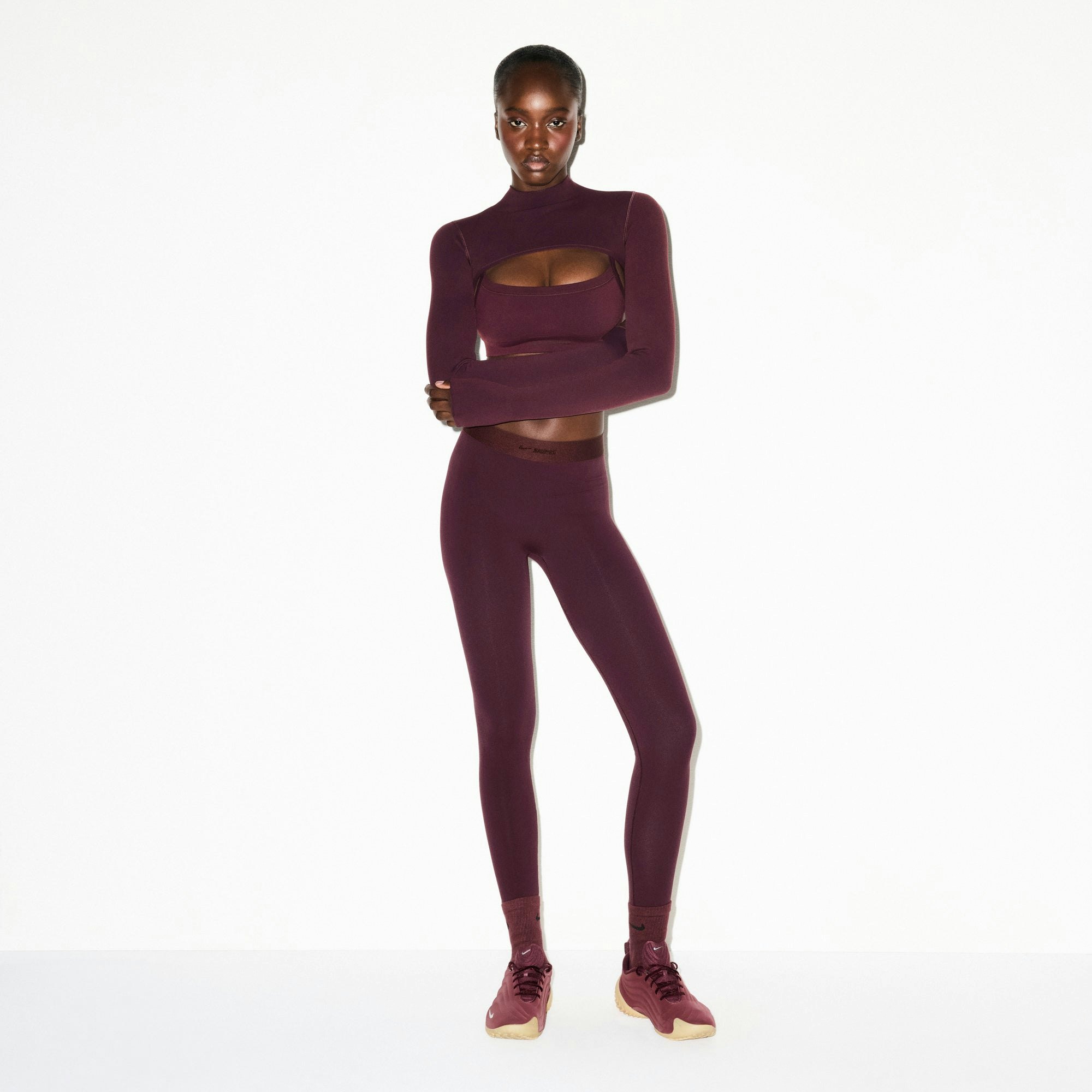 NikeSKIMS VINTAGE SEAMLESS SHRUG | CURRANT ON A MODEL FRONT VIEW @ | FOCUS: 0.0, 1.0, 0.9