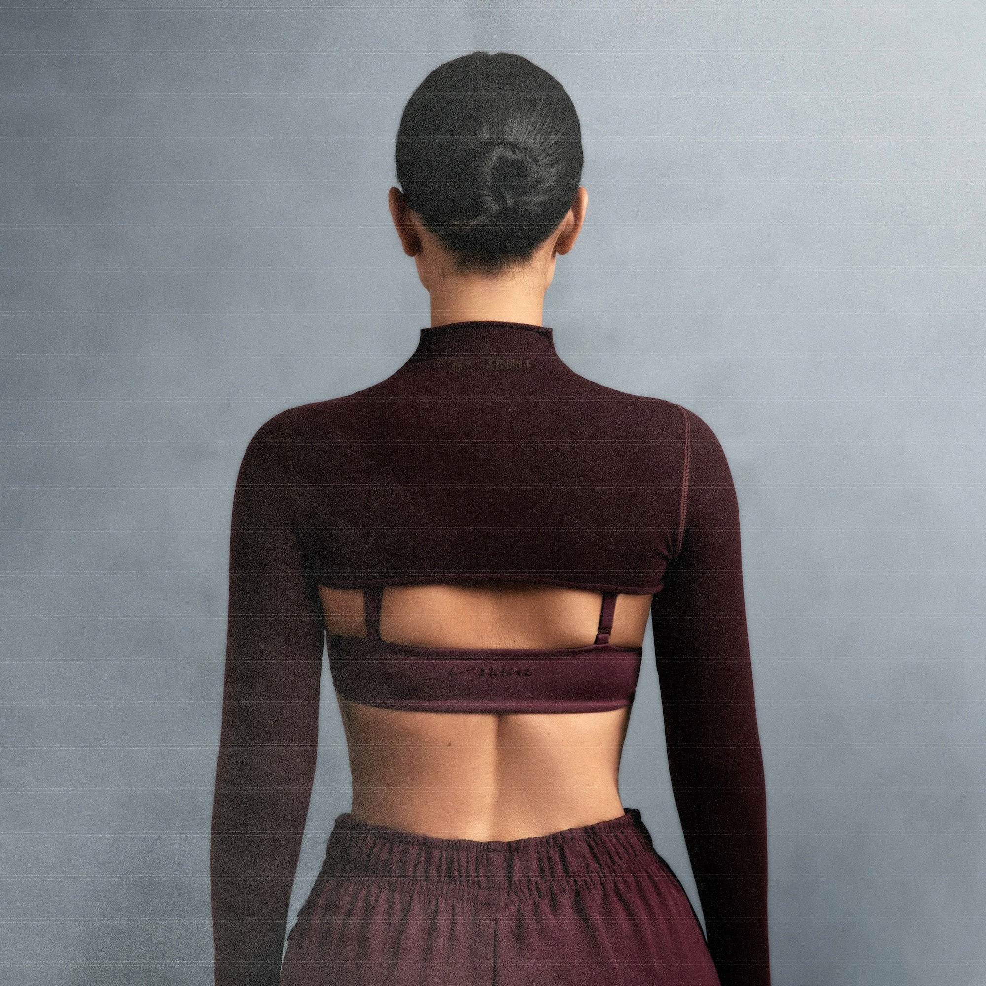 NikeSKIMS VINTAGE SEAMLESS SHRUG | CURRANT ON A MODEL SIDE VIEW @ | FOCUS: 0.0, 1.0, 0.9