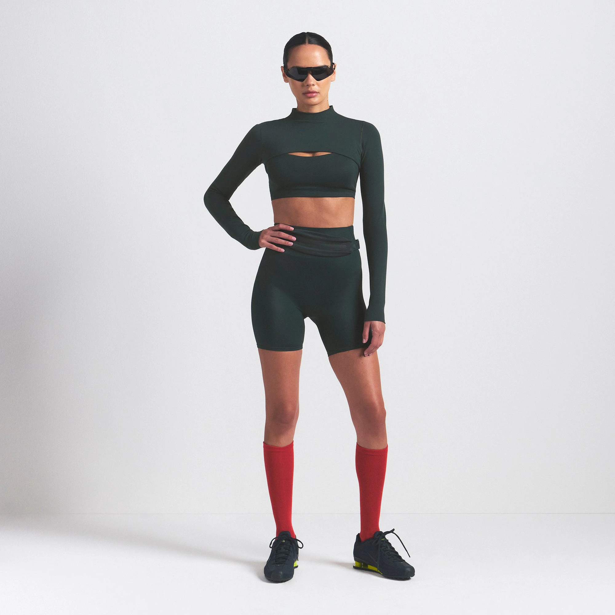 NikeSKIMS VINTAGE SEAMLESS SHRUG | DARK TEAL ON A MODEL FRONT VIEW @ | FOCUS: 0.0, 1.0, 0.9