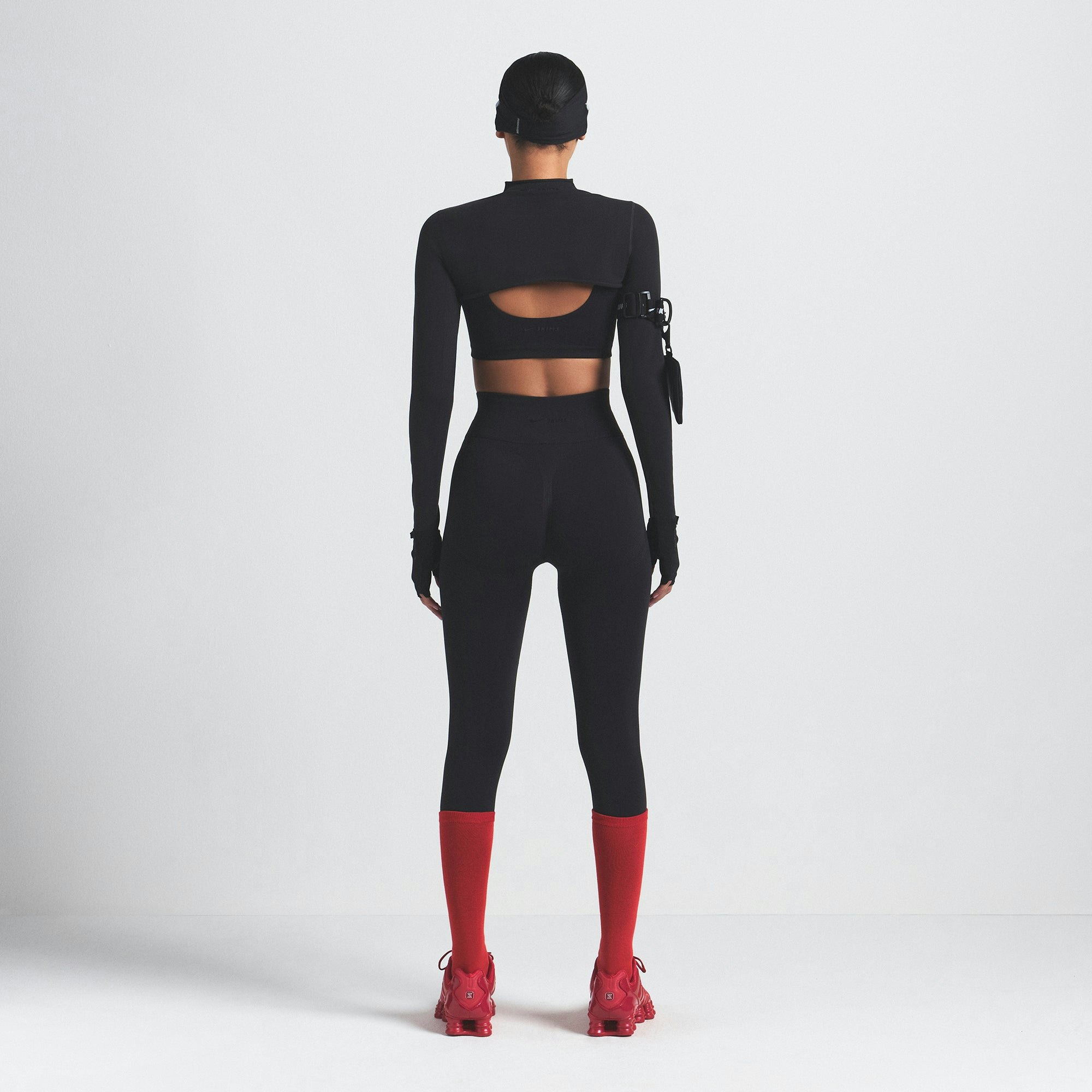 NikeSKIMS VINTAGE SEAMLESS SHRUG | OBSIDIAN ON A MODEL SIDE VIEW