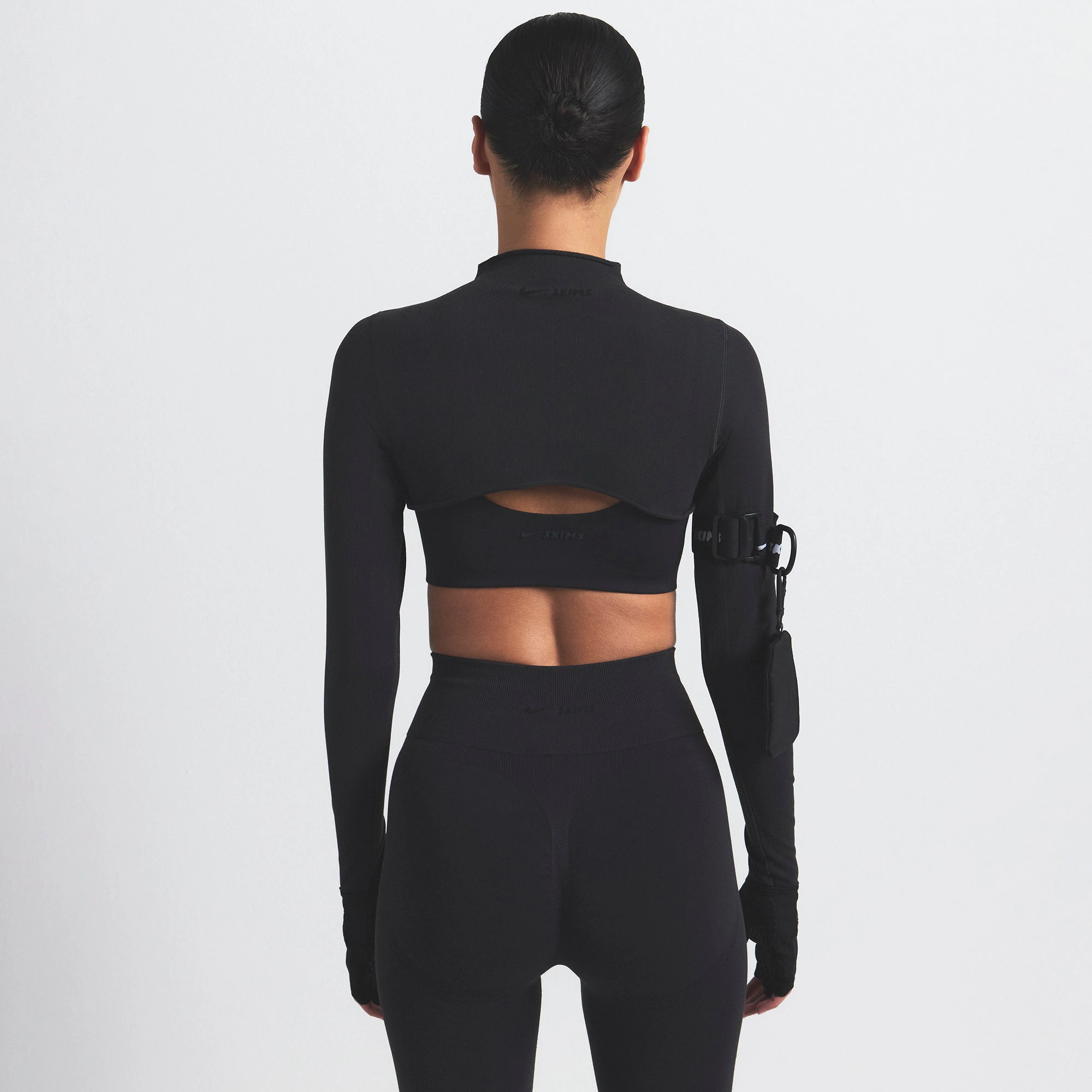 NikeSKIMS VINTAGE SEAMLESS SHRUG | OBSIDIAN ON A MODEL SIDE VIEW