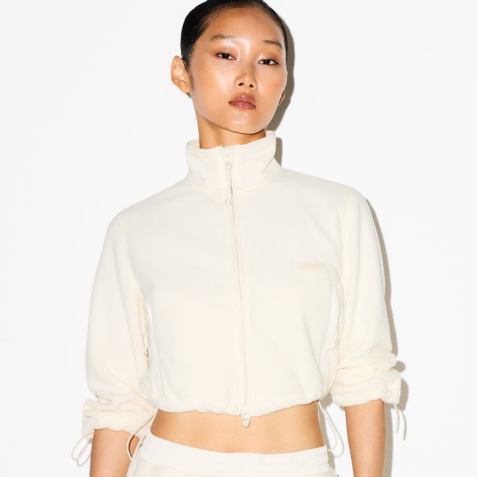 OUTDOOR FLEECE SHRUNKEN ZIP UP JACKET | ECRU ON A MODEL SIDE VIEW @ | FOCUS: 0.0, 1.0, 0.9