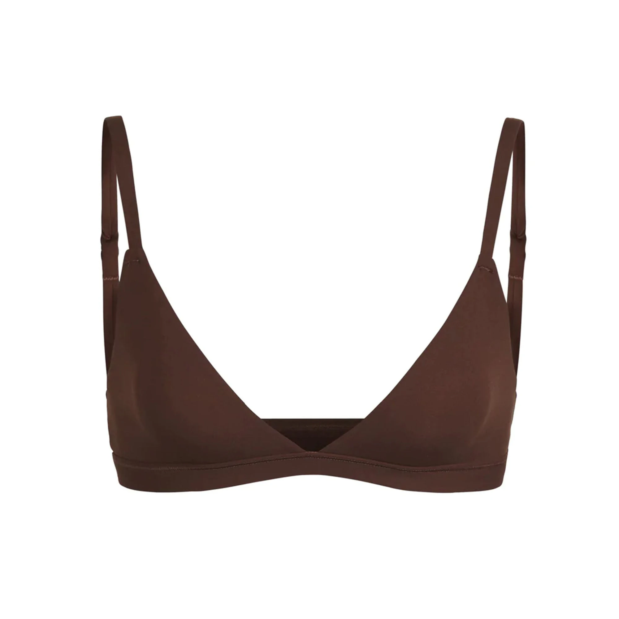 A warm-toned photo of the SKIMS Fits Everybody Triangle Bralette in Cocoa, showcasing its smooth, soft fabric.