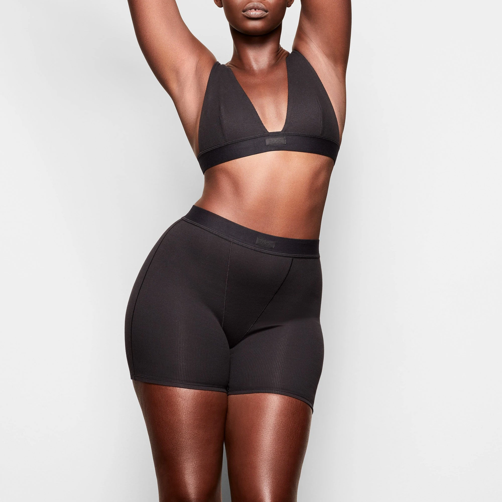 A MODEL STANDS FACING FORWARD WEARING THE COTTON SLEEP BUNDLE | SOOT