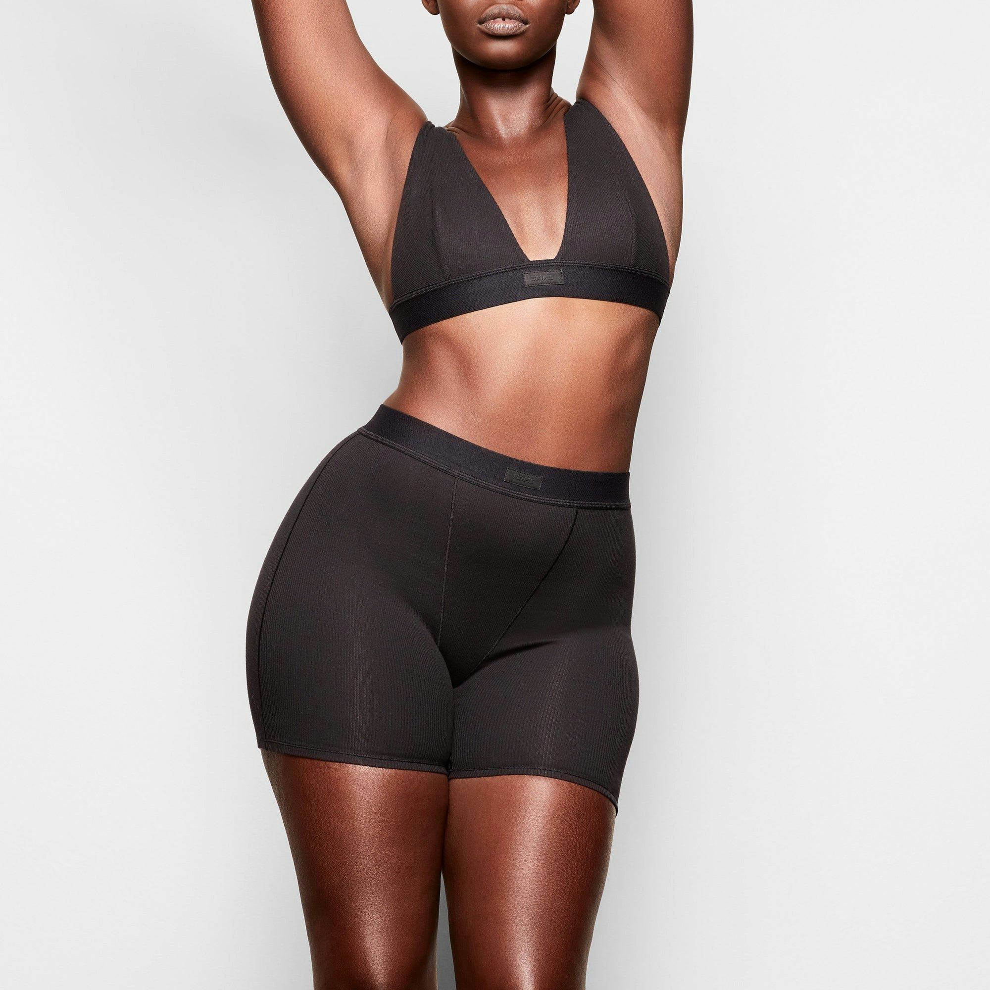 A MODEL STANDS FACING FORWARD WEARING THE COTTON SLEEP BUNDLE | SOOT