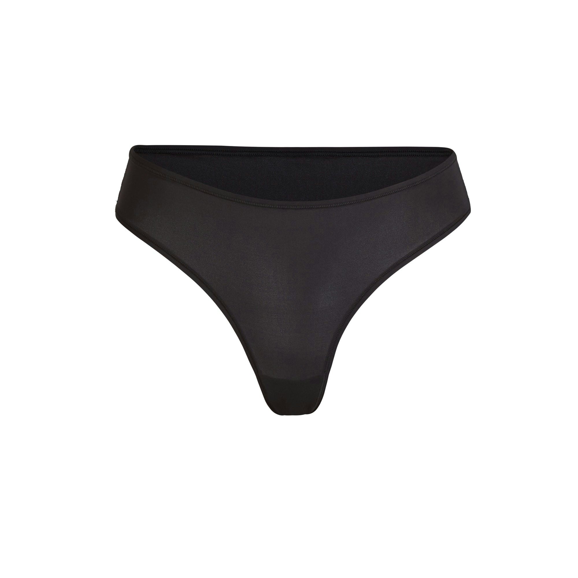 FITS EVERYBODY THONG | ONYX (THONGS, PANTIES) LAYS FLAT ON A WHITE BACKGROUND | FLT