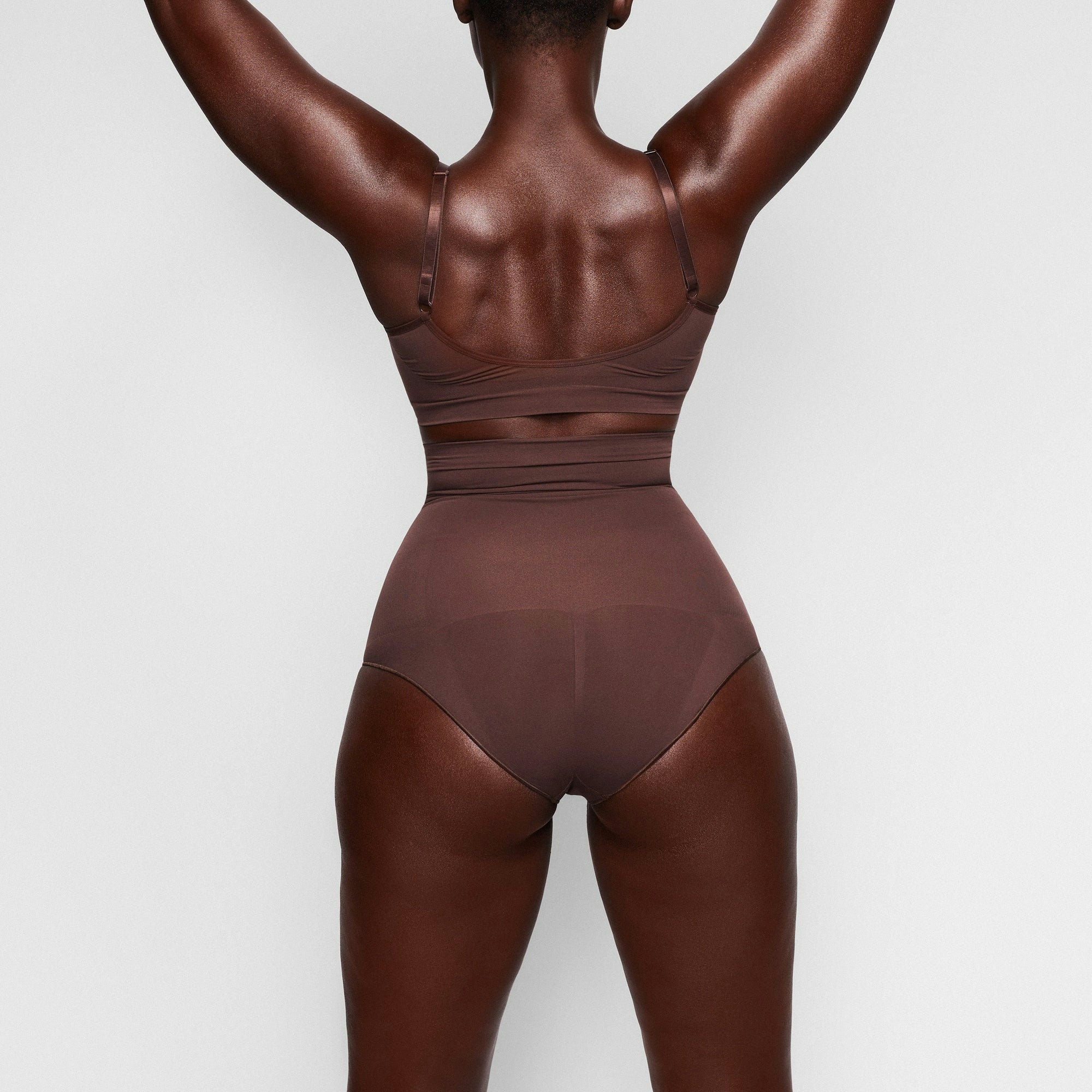 SEAMLESS SCULPT HIGH-WAISTED BRIEF ON A MODEL BACK VIEW