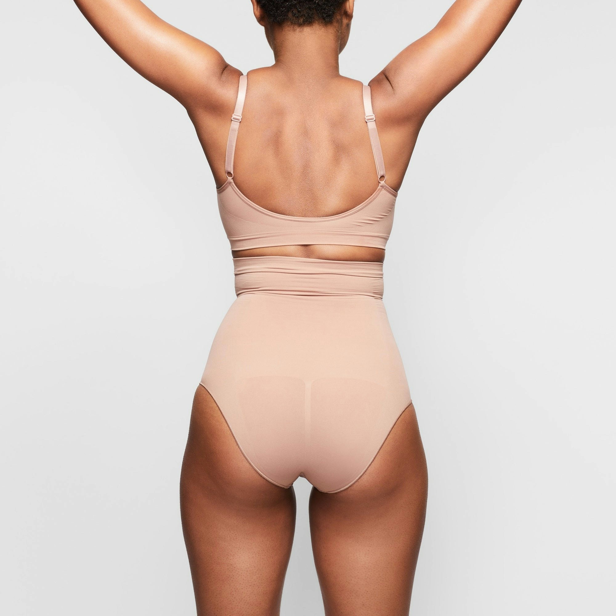 SEAMLESS SCULPT HIGH-WAISTED BRIEF ON A MODEL BACK VIEW