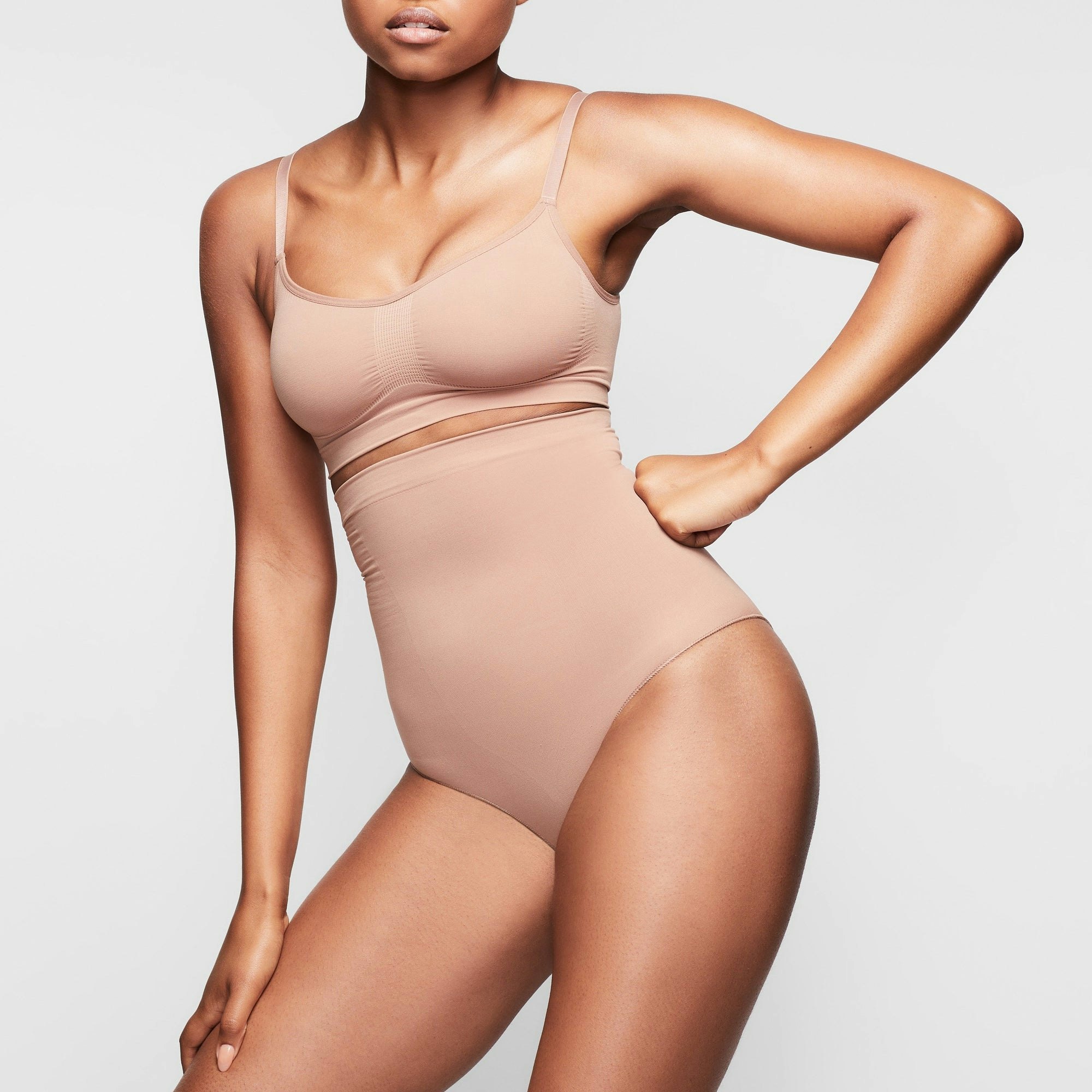 SEAMLESS SCULPT HIGH-WAISTED BRIEF WORN BY A MODEL IN SIDE VIEW
